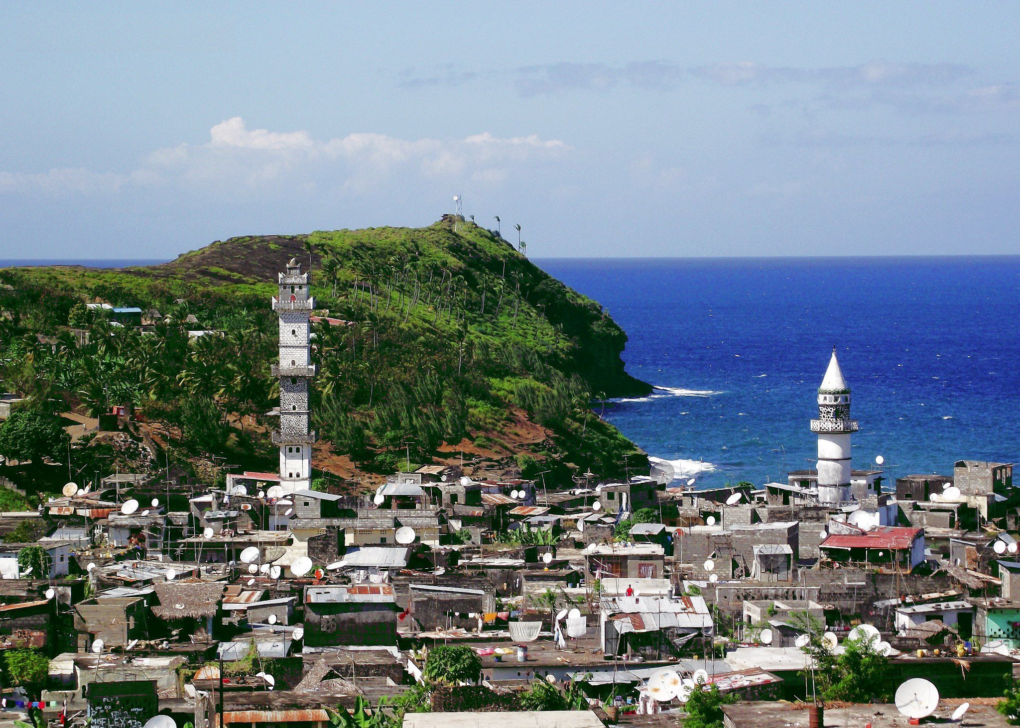 A view of Domoni, Anjouan, featuring a prominent mosque, illustrating the central role of Islam in Comorian life.