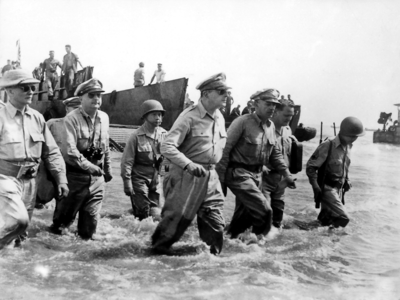 General Douglas MacArthur and President Sergio Osmeña (left) landing in Leyte on October 20, 1944, fulfilling MacArthur's