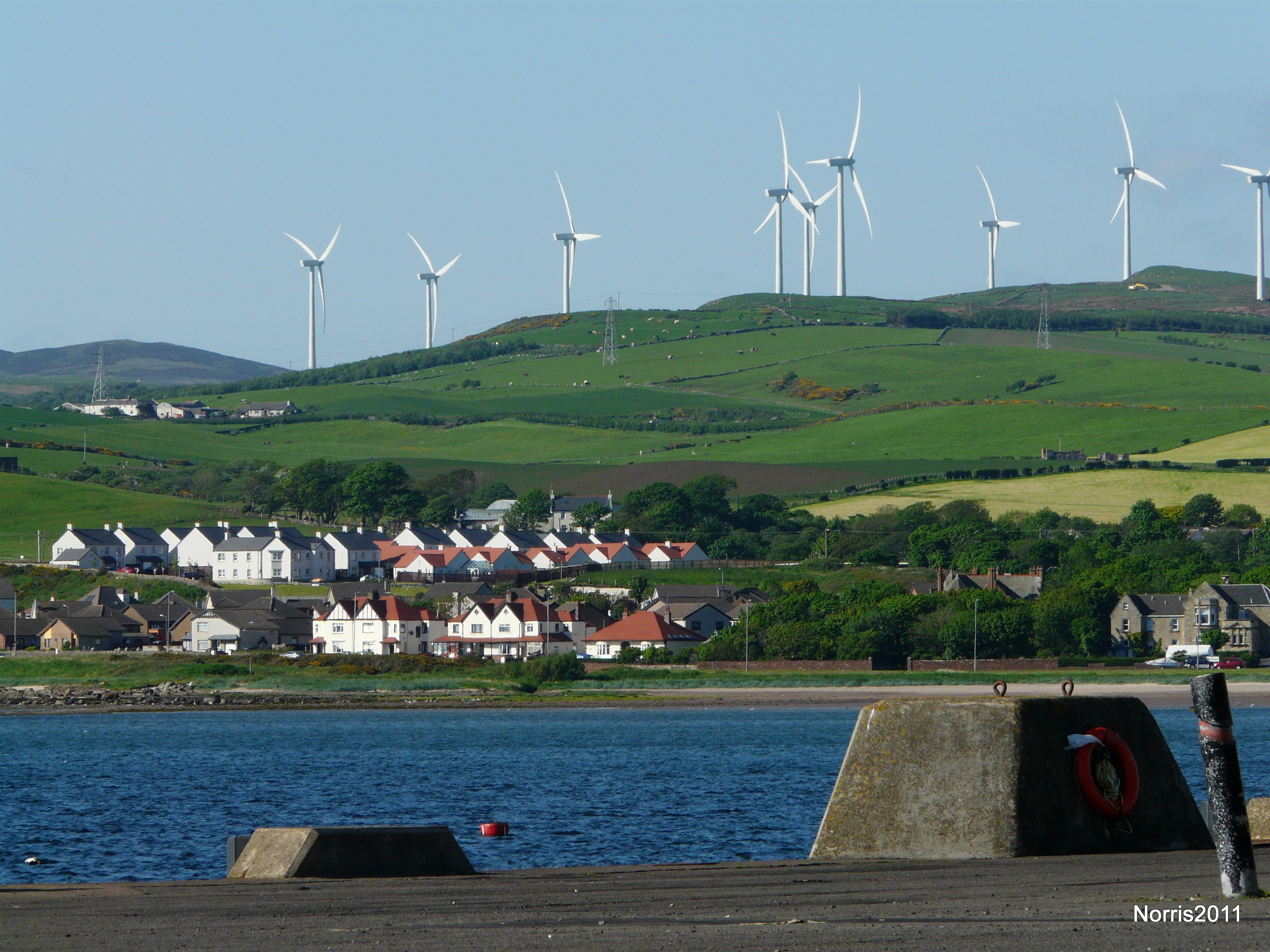 Wind turbines overlooking Ardrossan in Scotland. The UK is the best site in Europe for wind energy, and its wind power production is its fastest-growing supply.