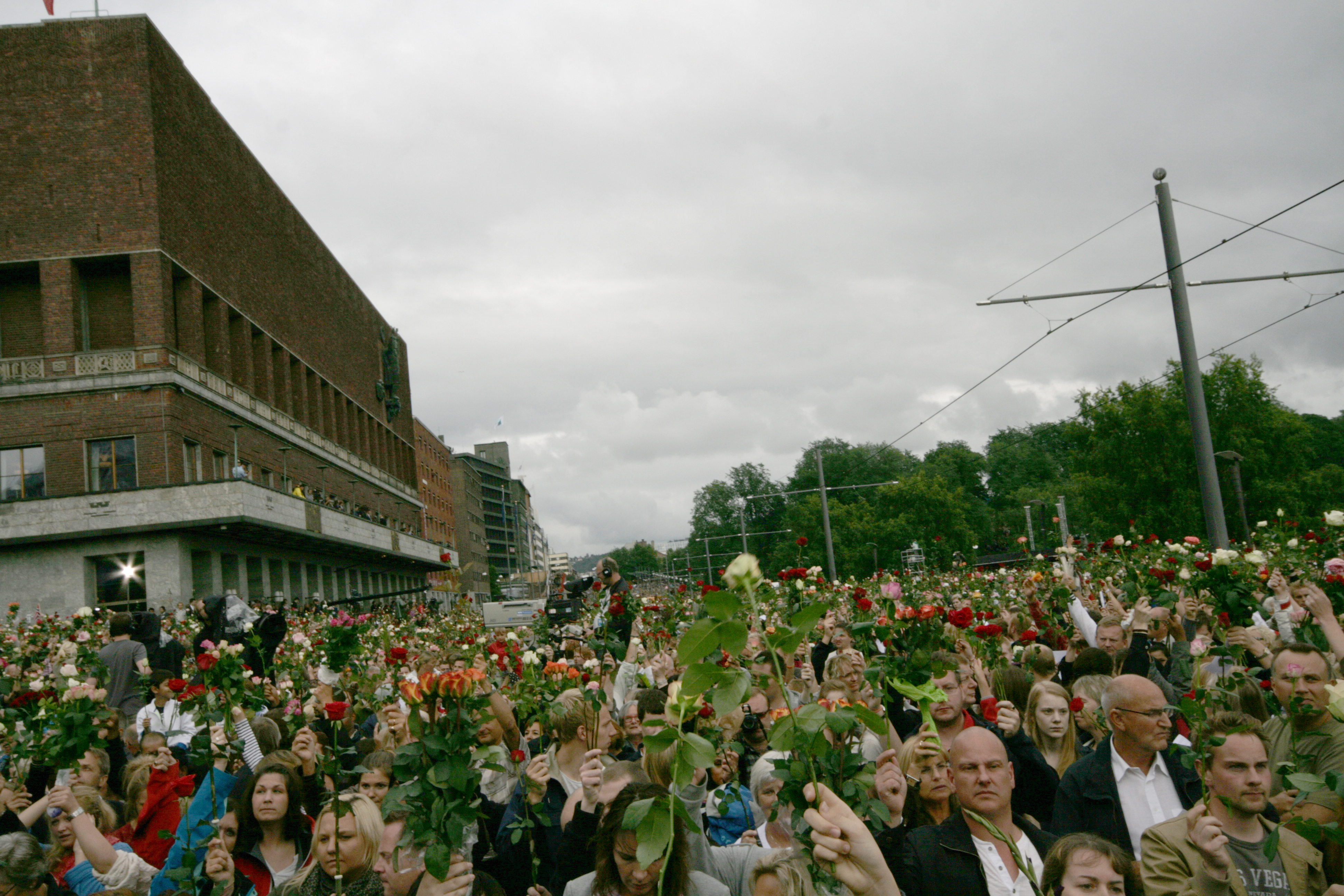 The Town Hall Square in Oslo filled with people holding roses, mourning the victims of the July 22, 2011, attacks, which included a bombing in Oslo and a mass shooting on Utøya island.