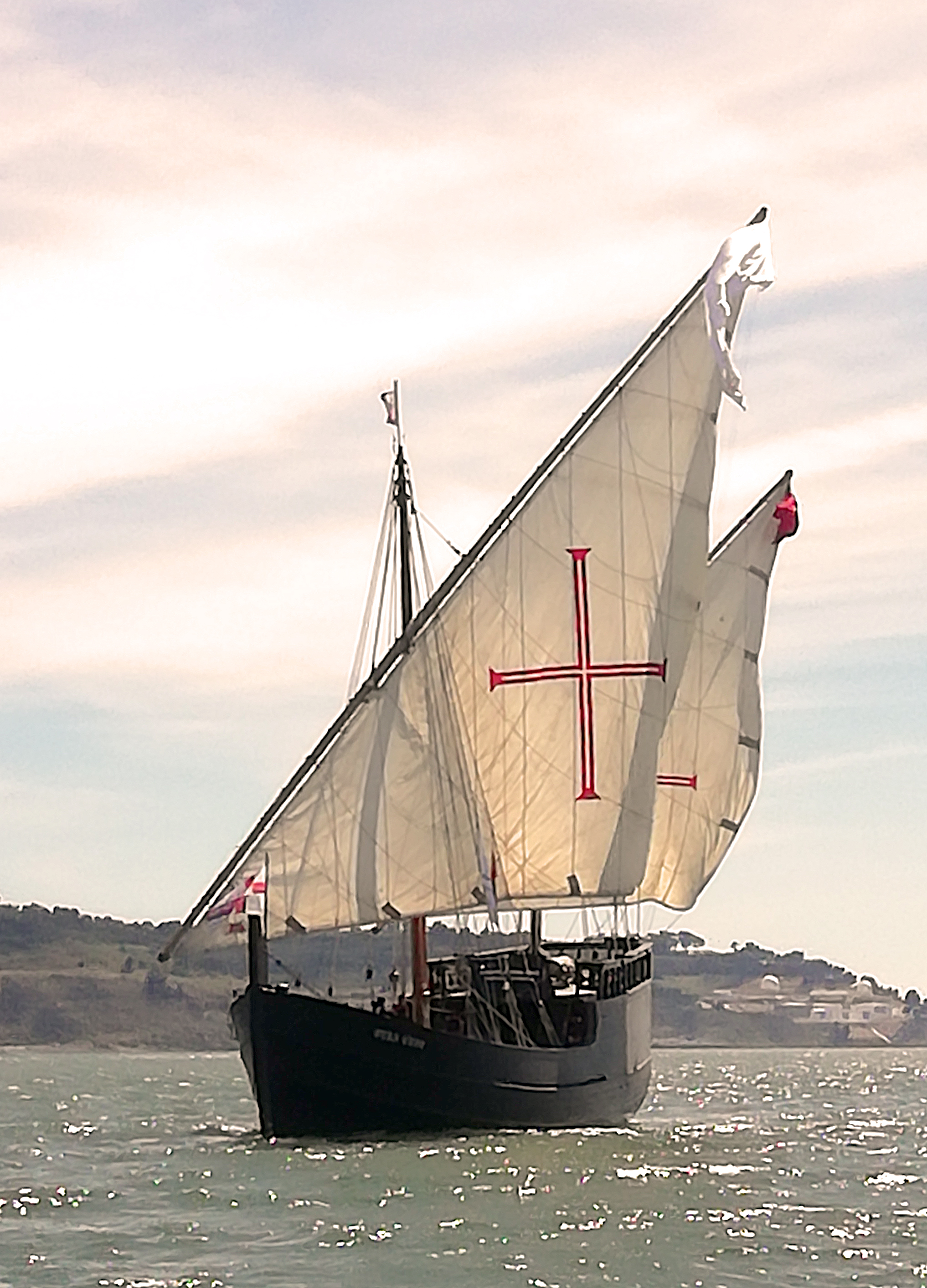 A replica of a Portuguese caravel, the type of ship used during the Age of Discovery, sailing on the Tagus River near Lisbon.