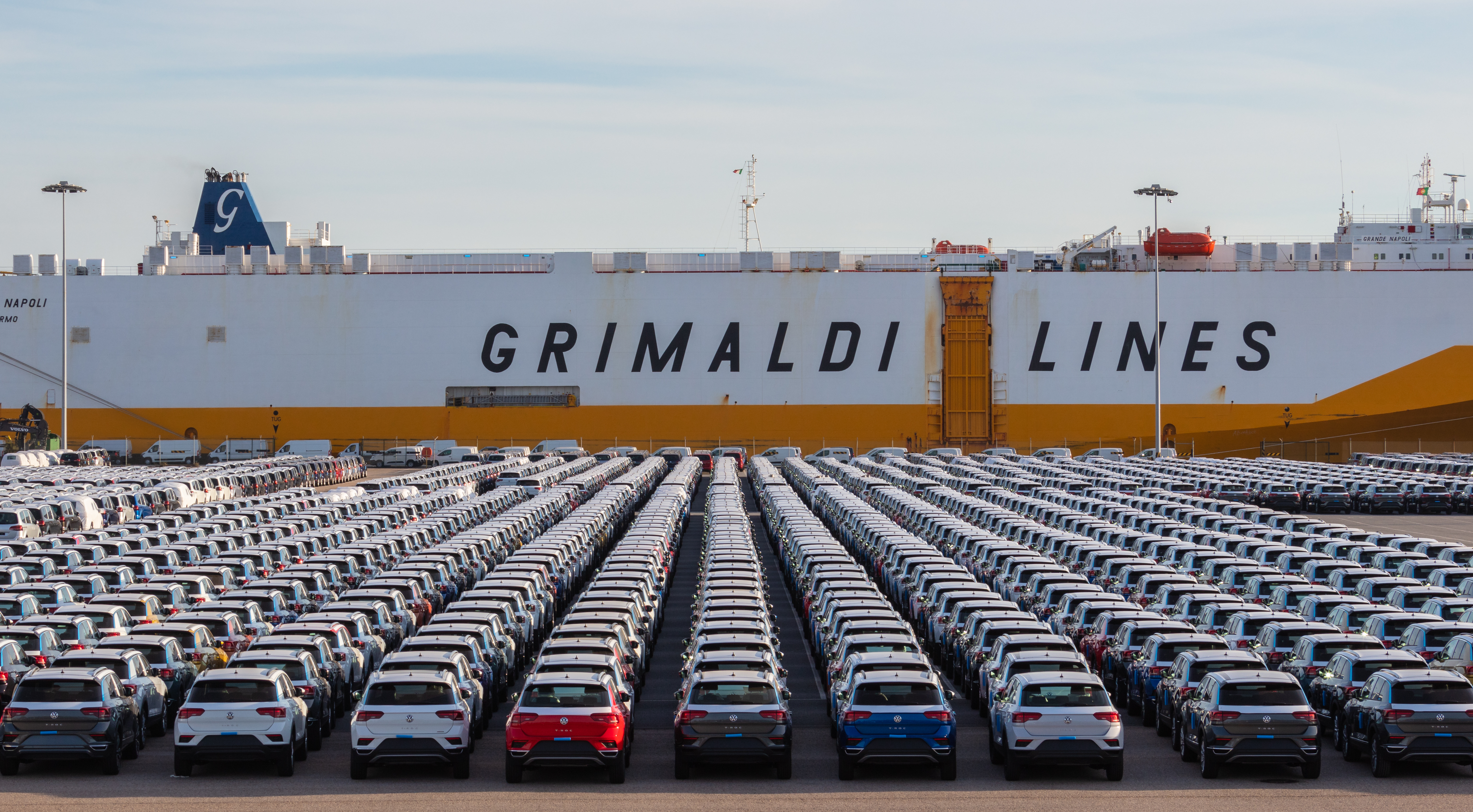 Volkswagen Autoeuropa cars at the Port of Setúbal, highlighting the importance of the automotive industry in Portugal's manufacturing sector.