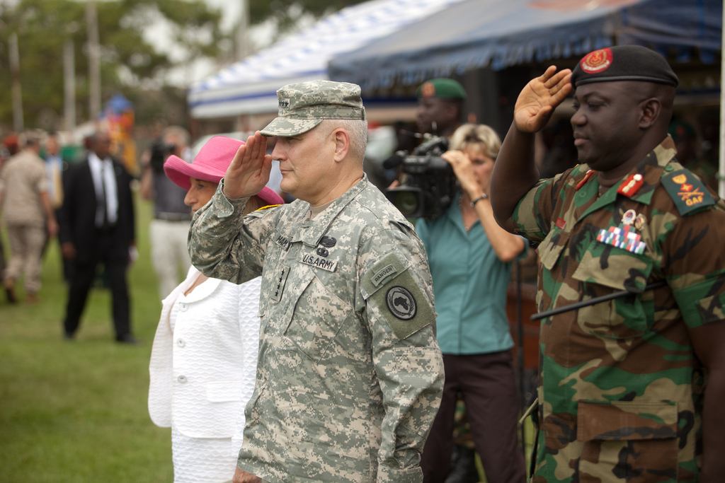 U.S. AFRICOM commander General Carter Ham and senior Gambian Army officer Masaneh Kinteh surveying troops, July 21, 2011, highlighting past military cooperation.