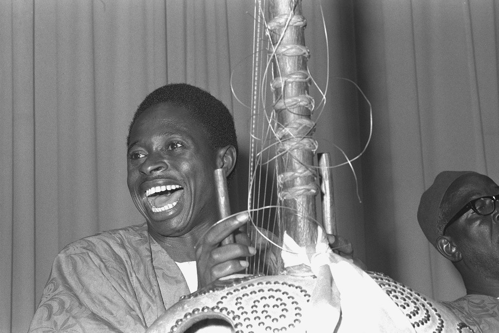 Gambian musicians performing on traditional instruments like the kora, hallam, and balafon at the Smithsonian Institution in 1977.