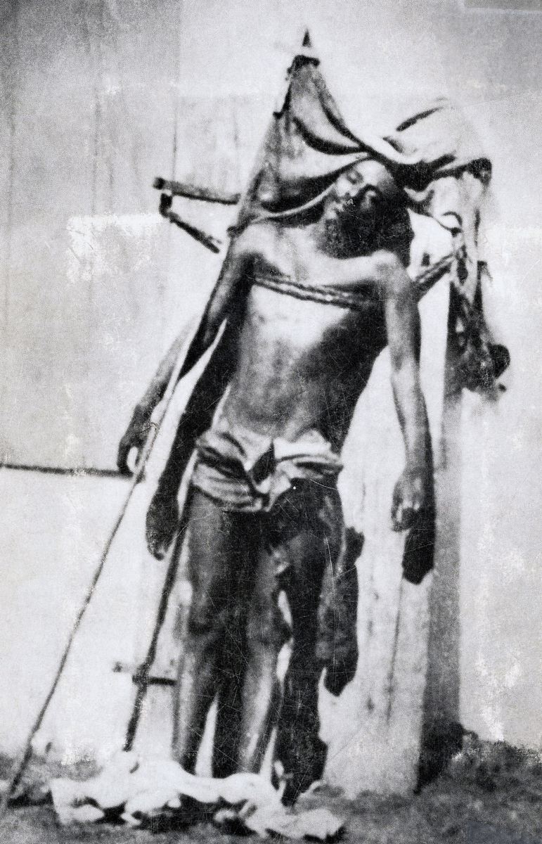 The body of Caco leader Charlemagne Péralte displayed by U.S. Marines after his execution in 1919. The image, intended to deter resistance, inadvertently turned Péralte into a national martyr due to its resemblance to depictions of the Deposition of Christ.