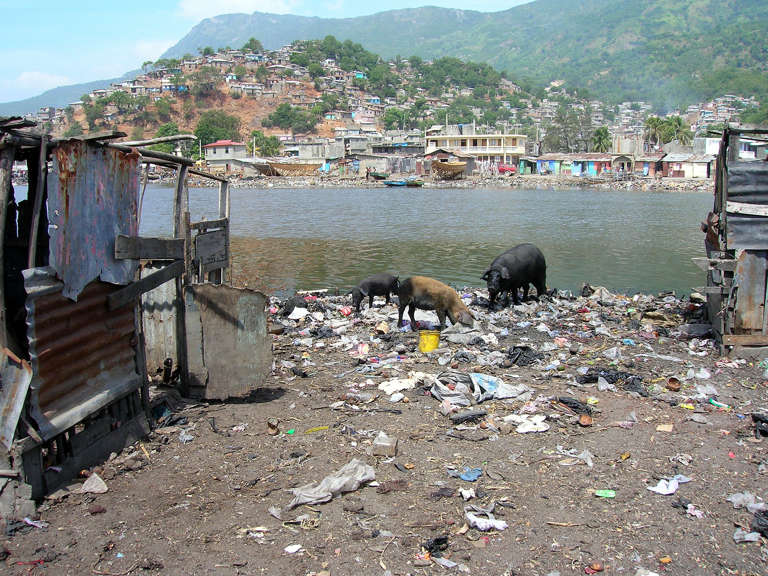 Waste dumping in a slum area of Cap-Haïtien. Precarious housing and lack of sanitation are major issues in urban slums.
