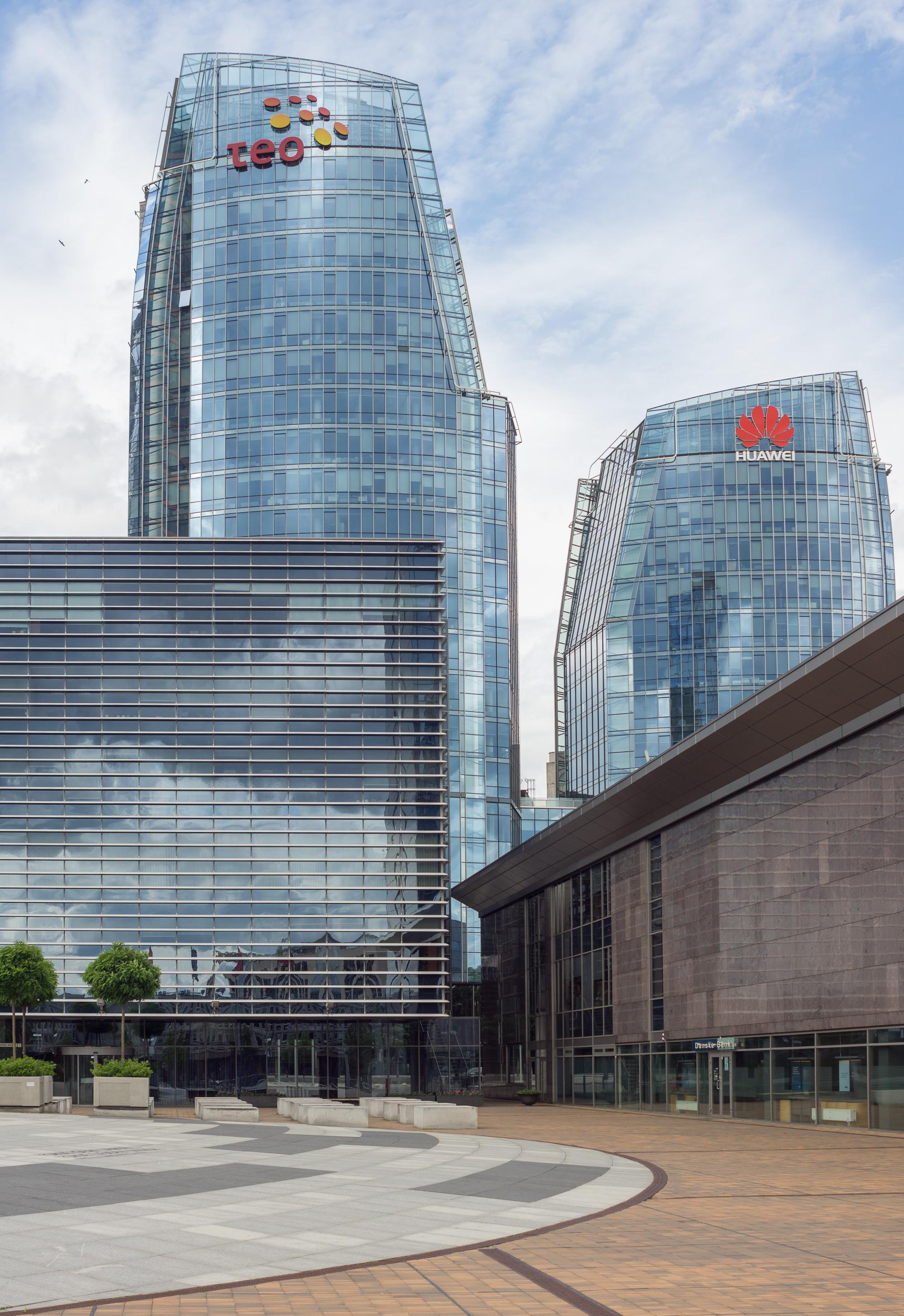 The headquarters of Telia Lietuva (skyscraper with the old Teo LT logo) and Huawei in Vilnius, representing the modern telecommunications sector.