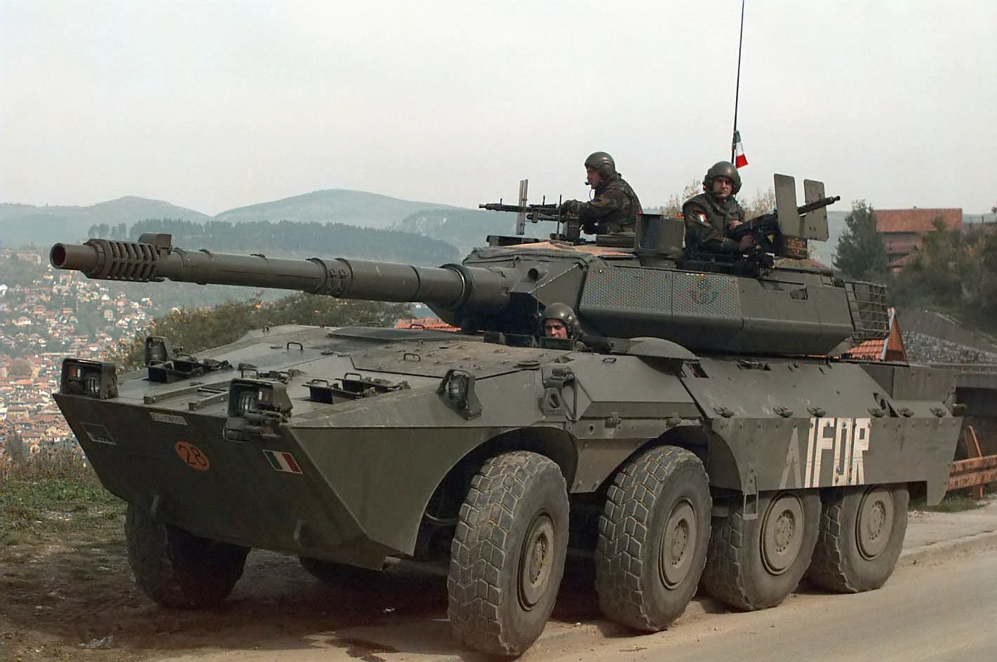 An Italian B1 Centauro tank destroyer on patrol in Bosnia and Herzegovina as part of the NATO-led IFOR, showcasing Italy's participation in international peacekeeping.