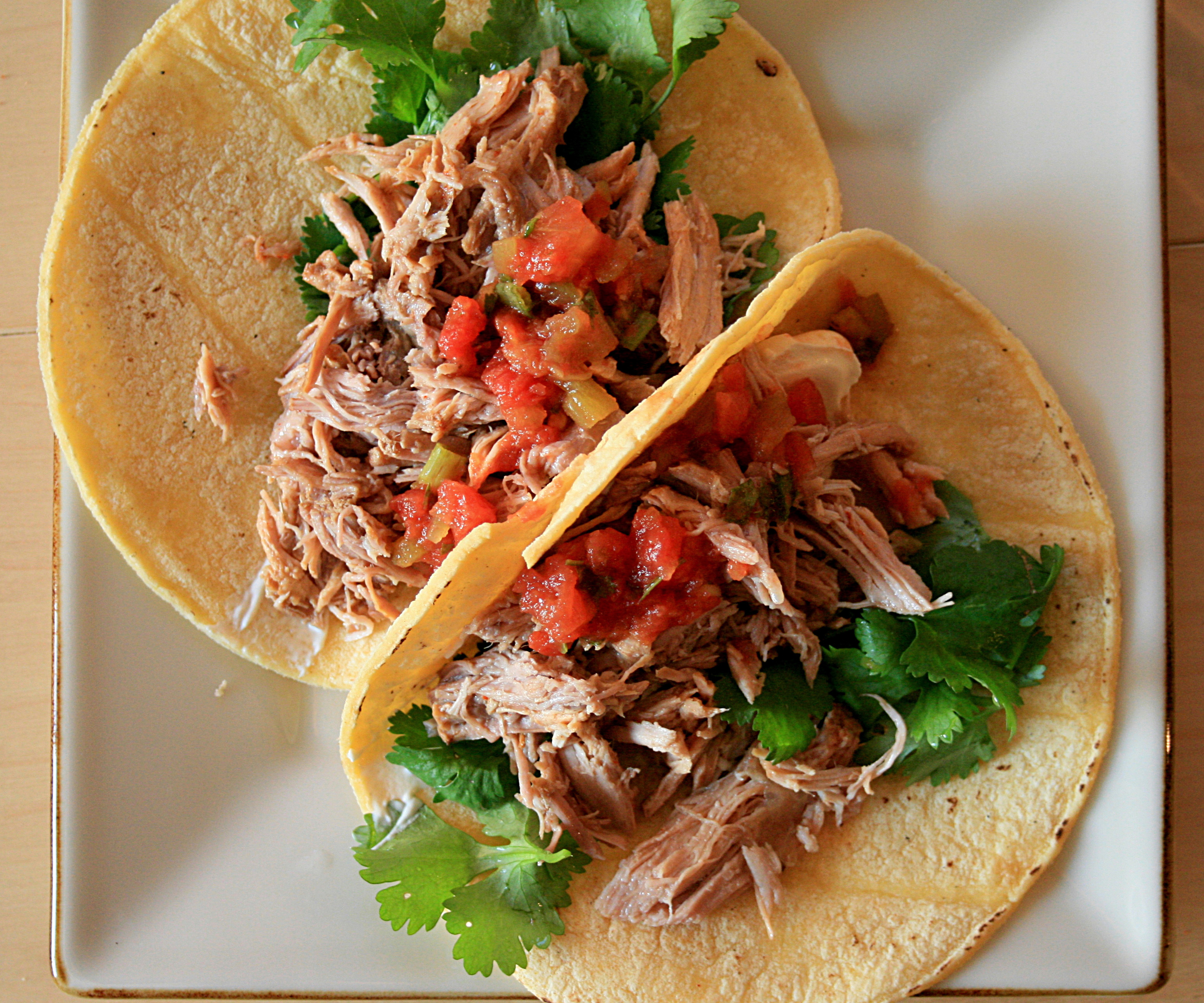 Tacos, a quintessential Mexican dish featuring corn or wheat tortillas filled with various ingredients, are popular worldwide.