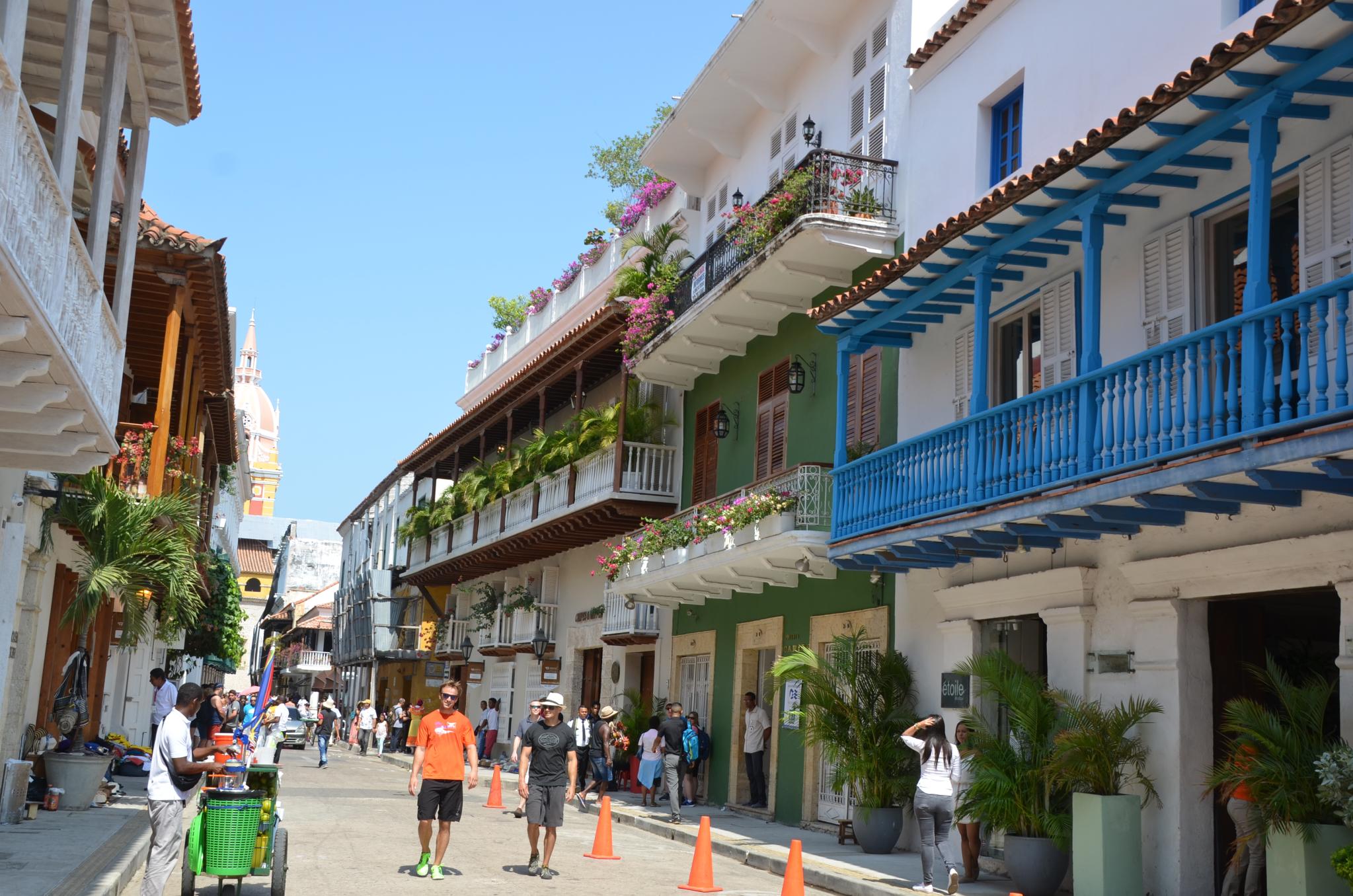 Colonial balconies in the streets of Cartagena, Colombia. The preserved colonial architecture of cities like Cartagena is a significant part of Colombia's cultural heritage, reflecting historical influences and social structures, while also being central to its tourism industry that should aim for community benefit.