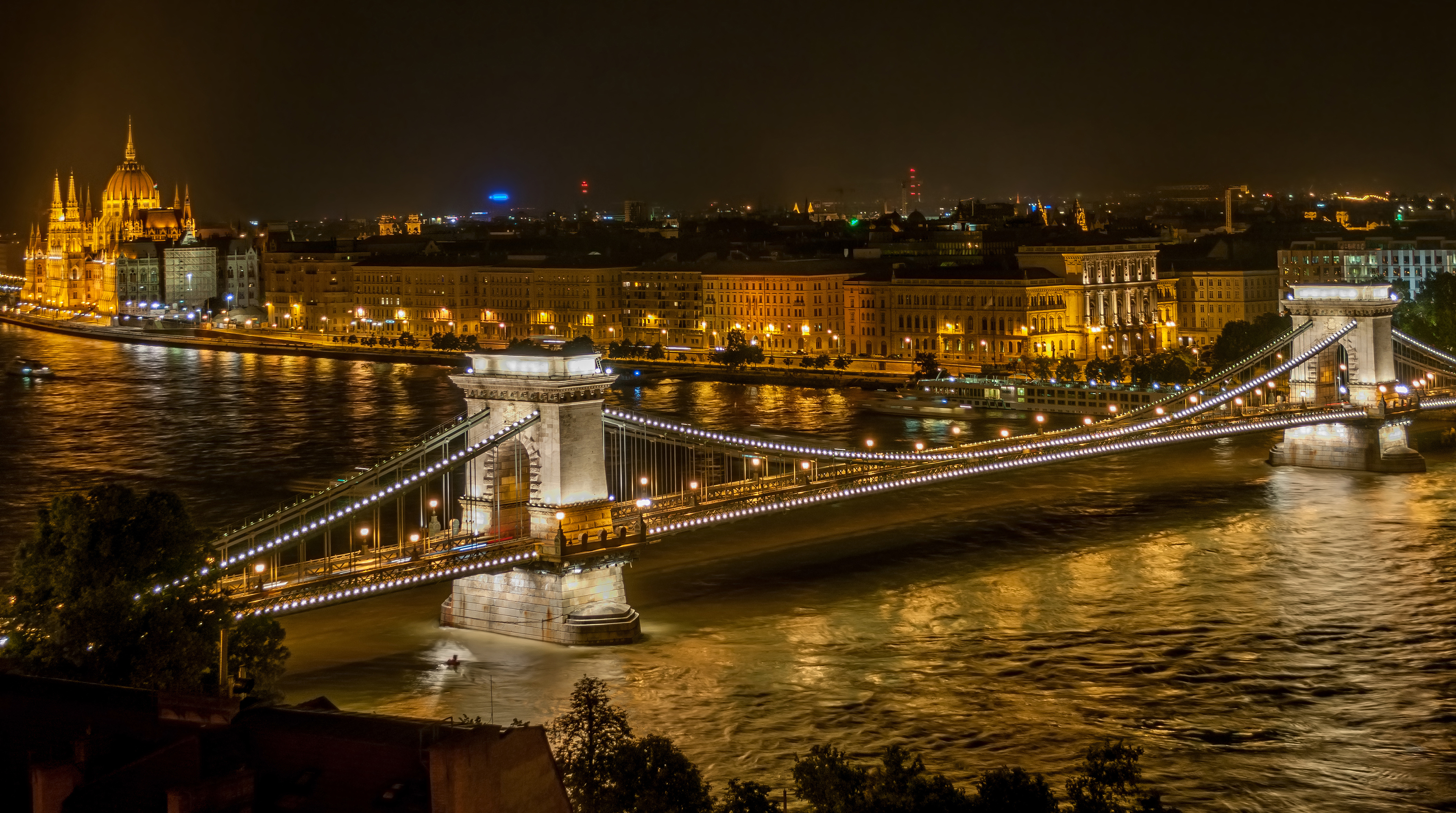 Budapest, the capital and most populous city of Hungary, viewed at night with the Széchenyi Chain Bridge and Buda Castle.