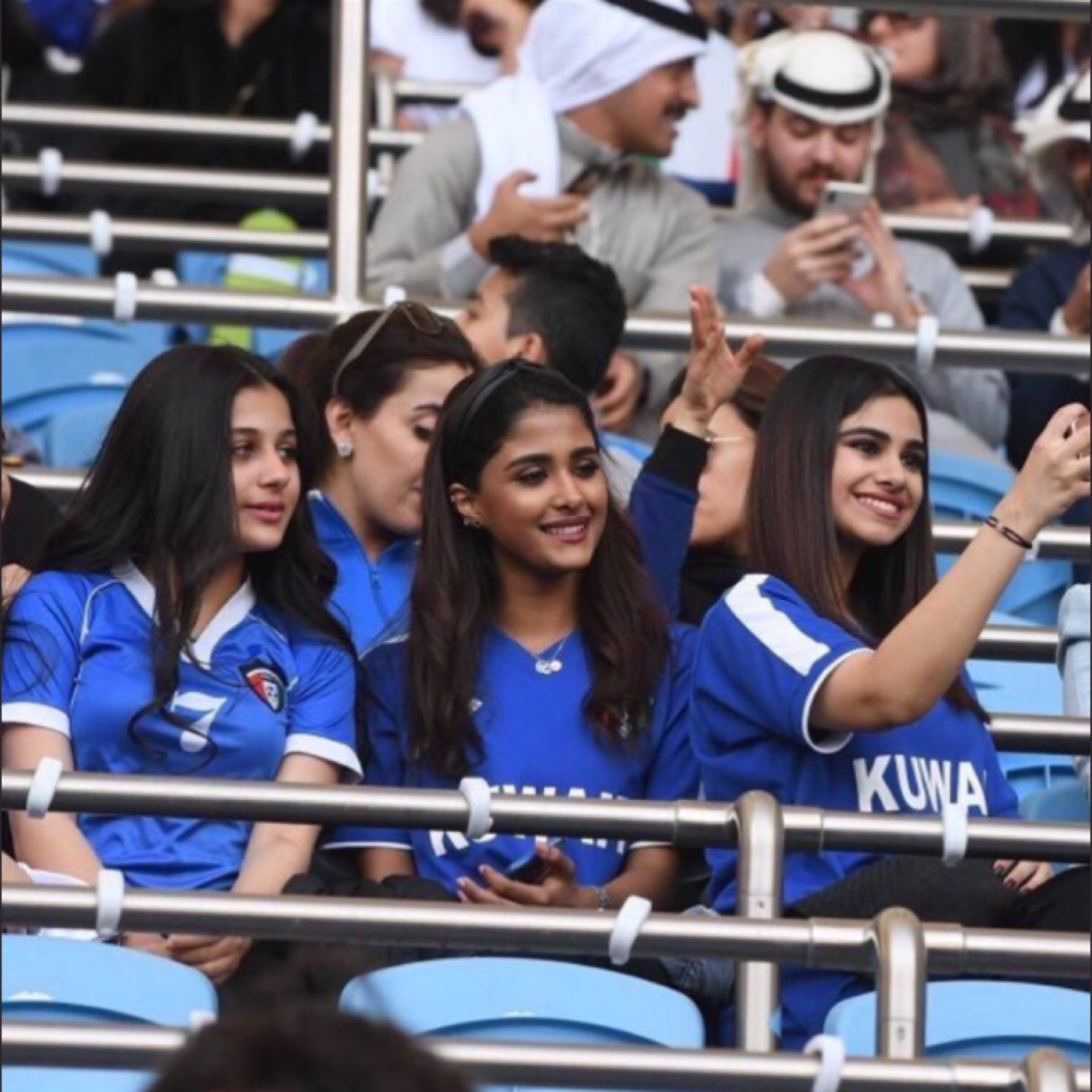 Kuwaiti women spectators at a local football match, illustrating the popularity of the sport.