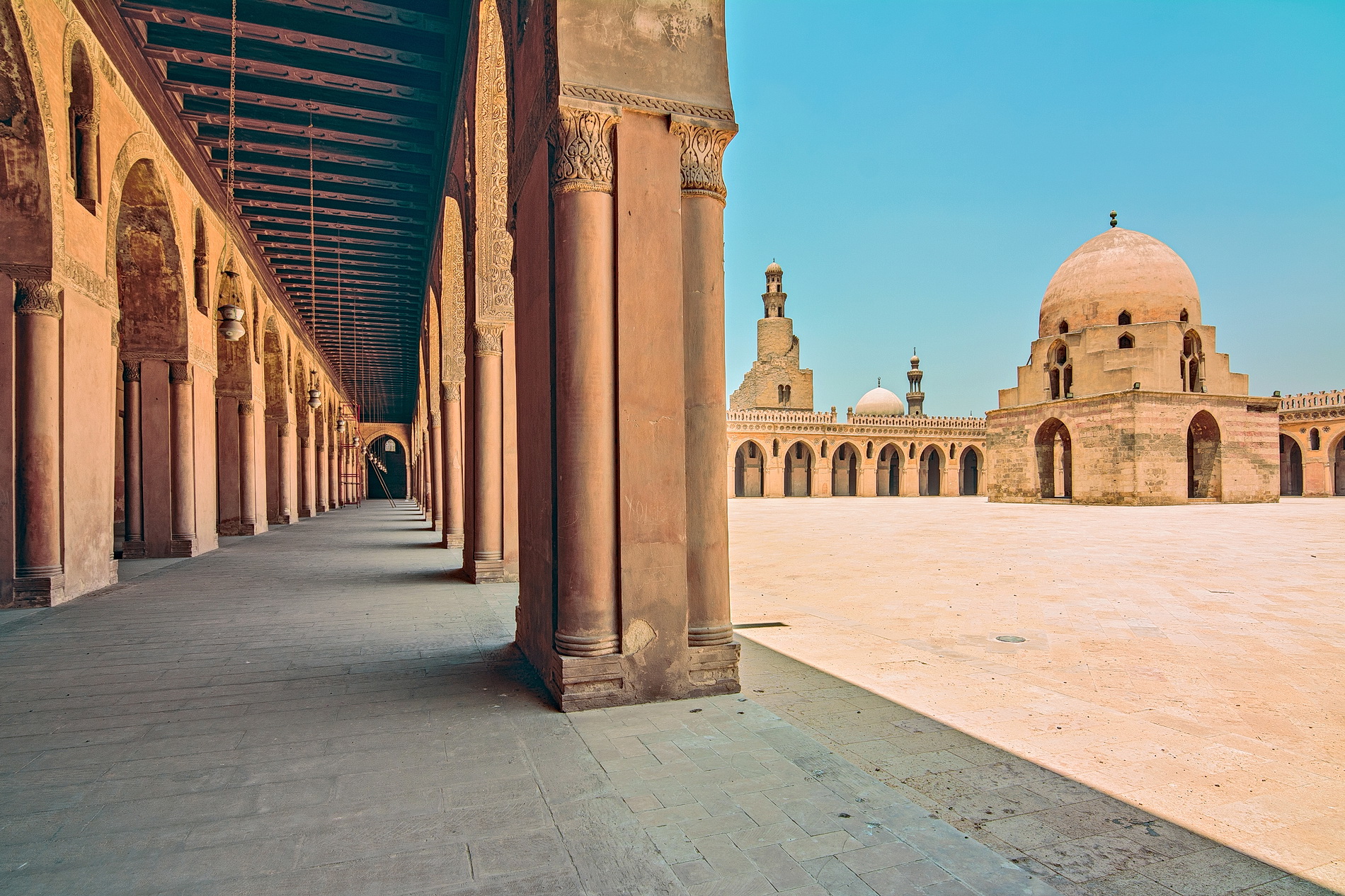 The Ibn Tulun Mosque in Cairo, built by Ahmad Ibn Tulun, reflects the architectural style of the early Islamic period in Egypt.