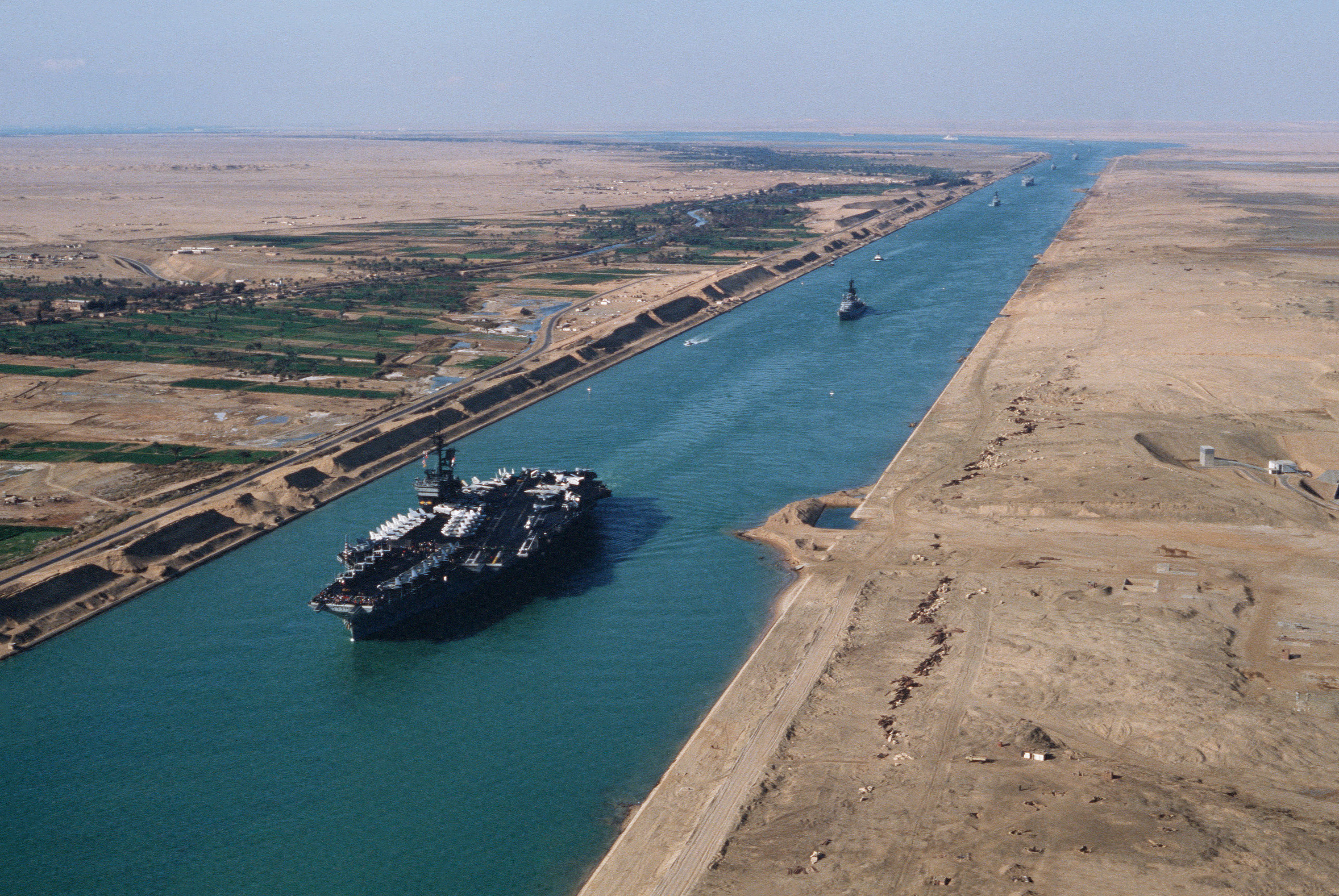 The USS America (CV-66) transiting the Suez Canal in 1981. The canal is a vital waterway for international shipping and a key source of revenue for Egypt.