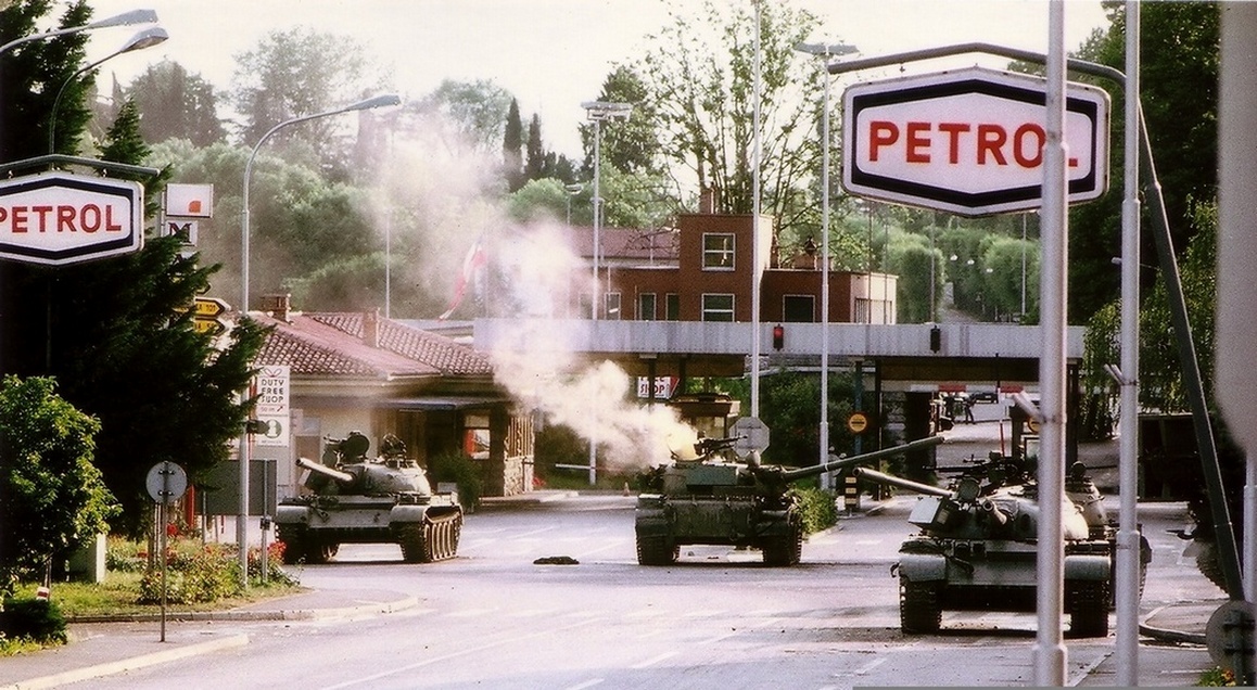 Slovenian Territorial Defense units counterattacking a Yugoslav People's Army tank during the Ten-Day War in 1991. This popular resistance was crucial for achieving independence.