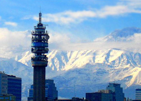 Torre Entel in Santiago, with the Andes mountains in the background.