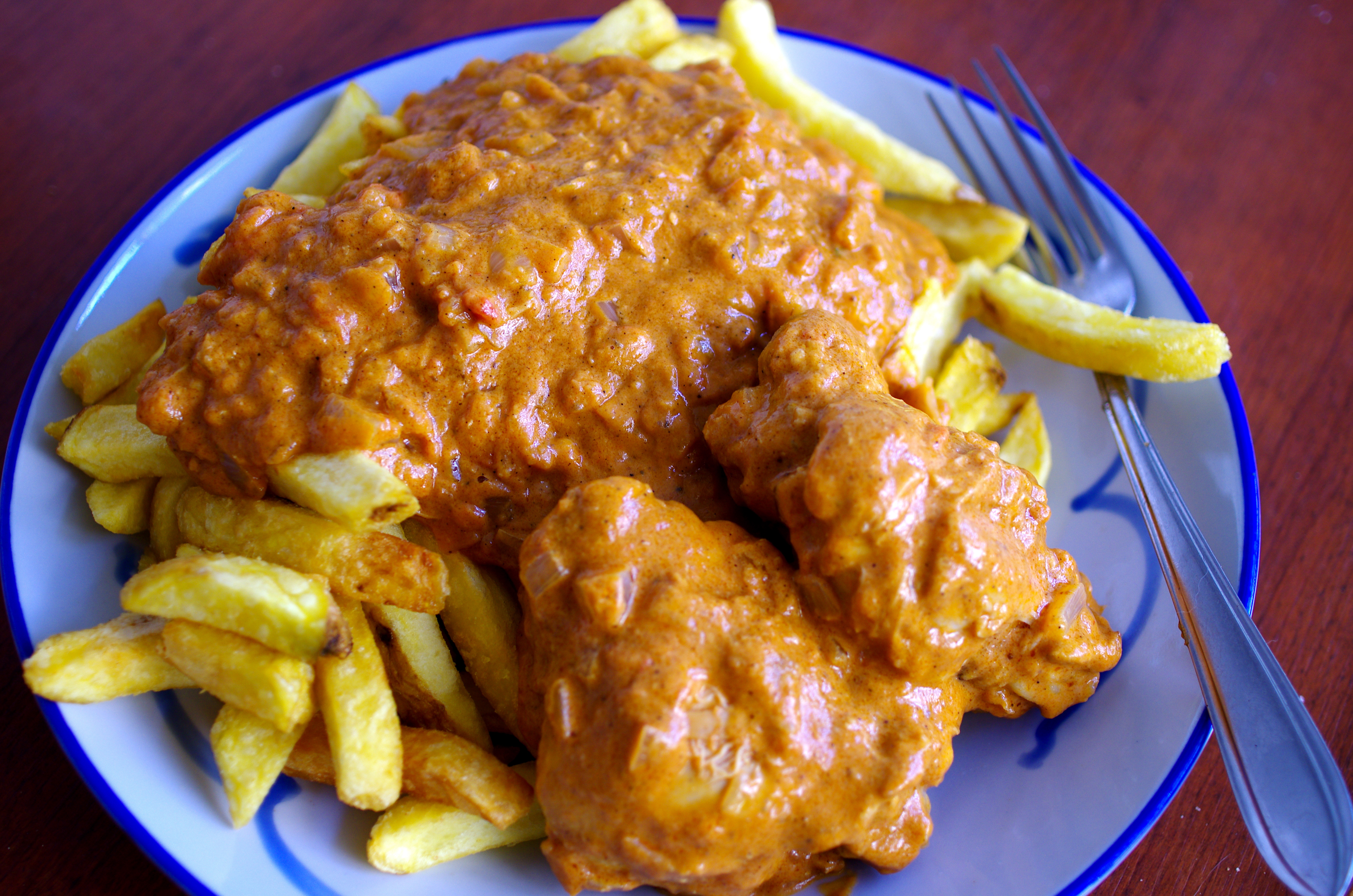 Muamba chicken with French fries.