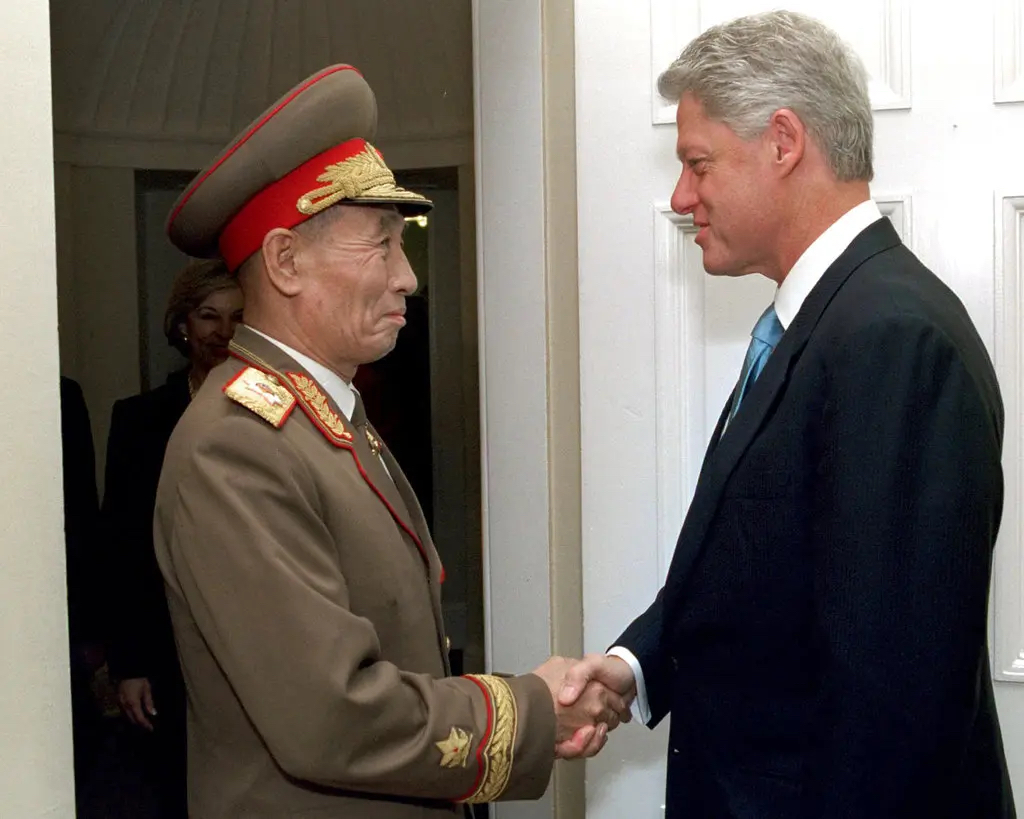 Then-North Korean Vice Marshal Cho Myong-rok shaking hands with U.S. President Bill Clinton in Washington D.C., October 2000.