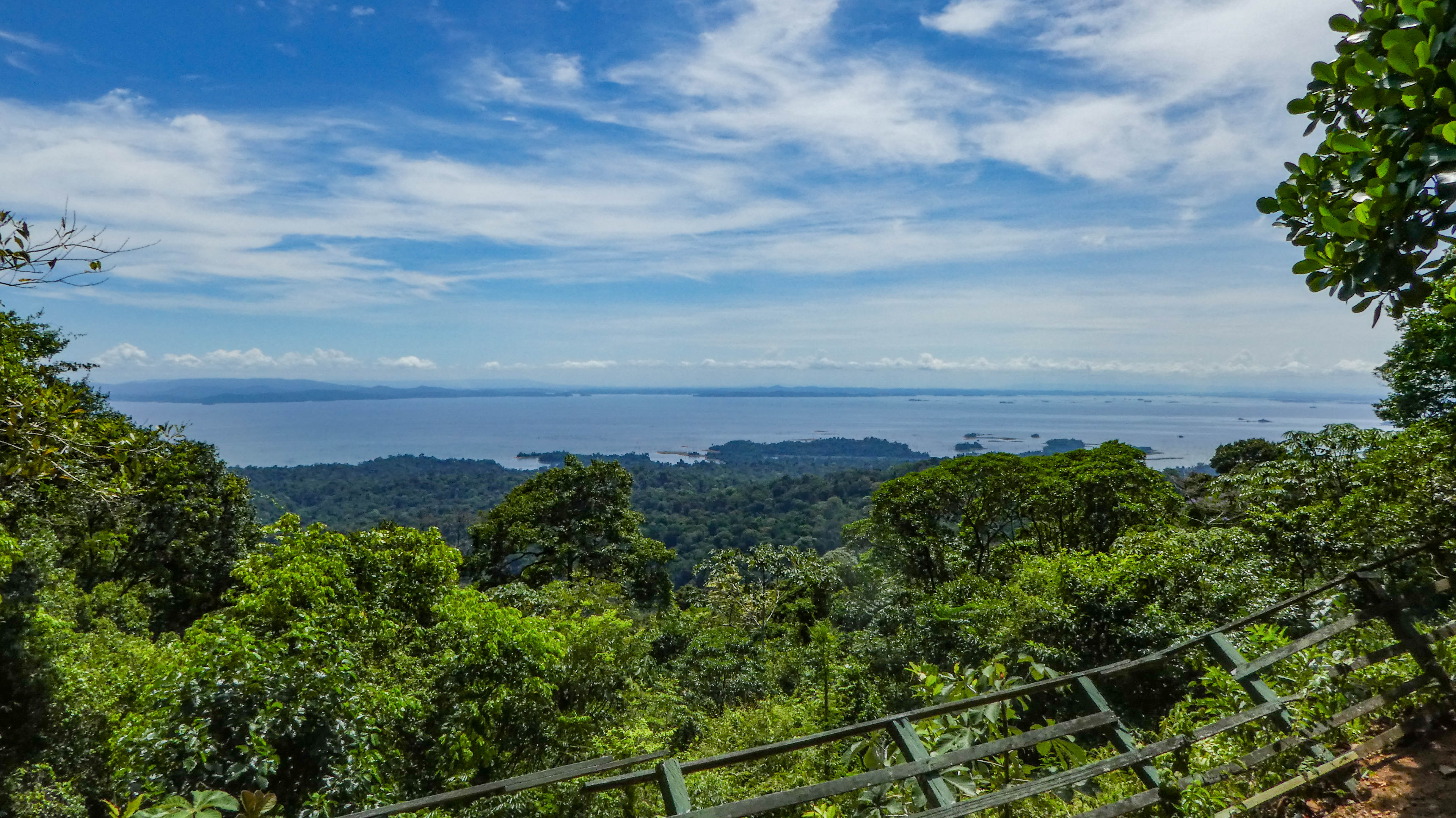 The Brokopondo Reservoir, an extensive man-made lake surrounded by tropical rainforest, crucial for hydroelectric power.