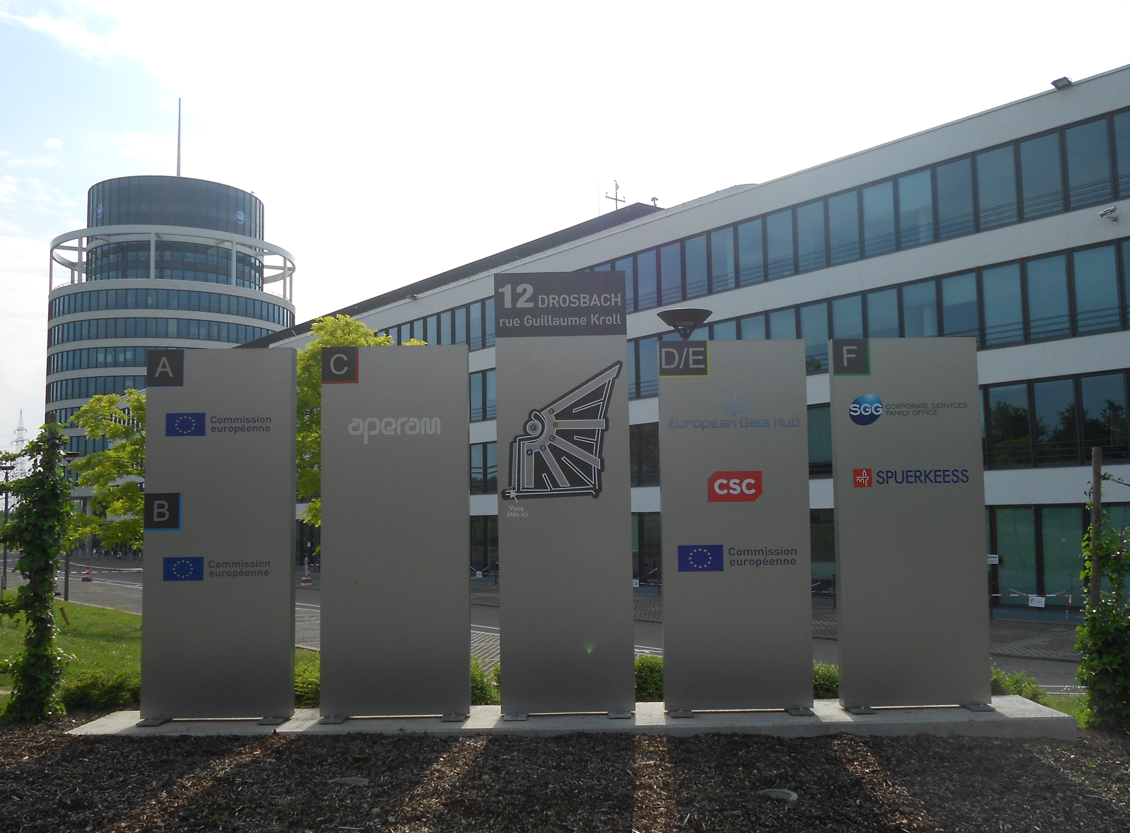 Signs in front of the Centre Drosbach on the Cloche d'or, in the city of Luxembourg City