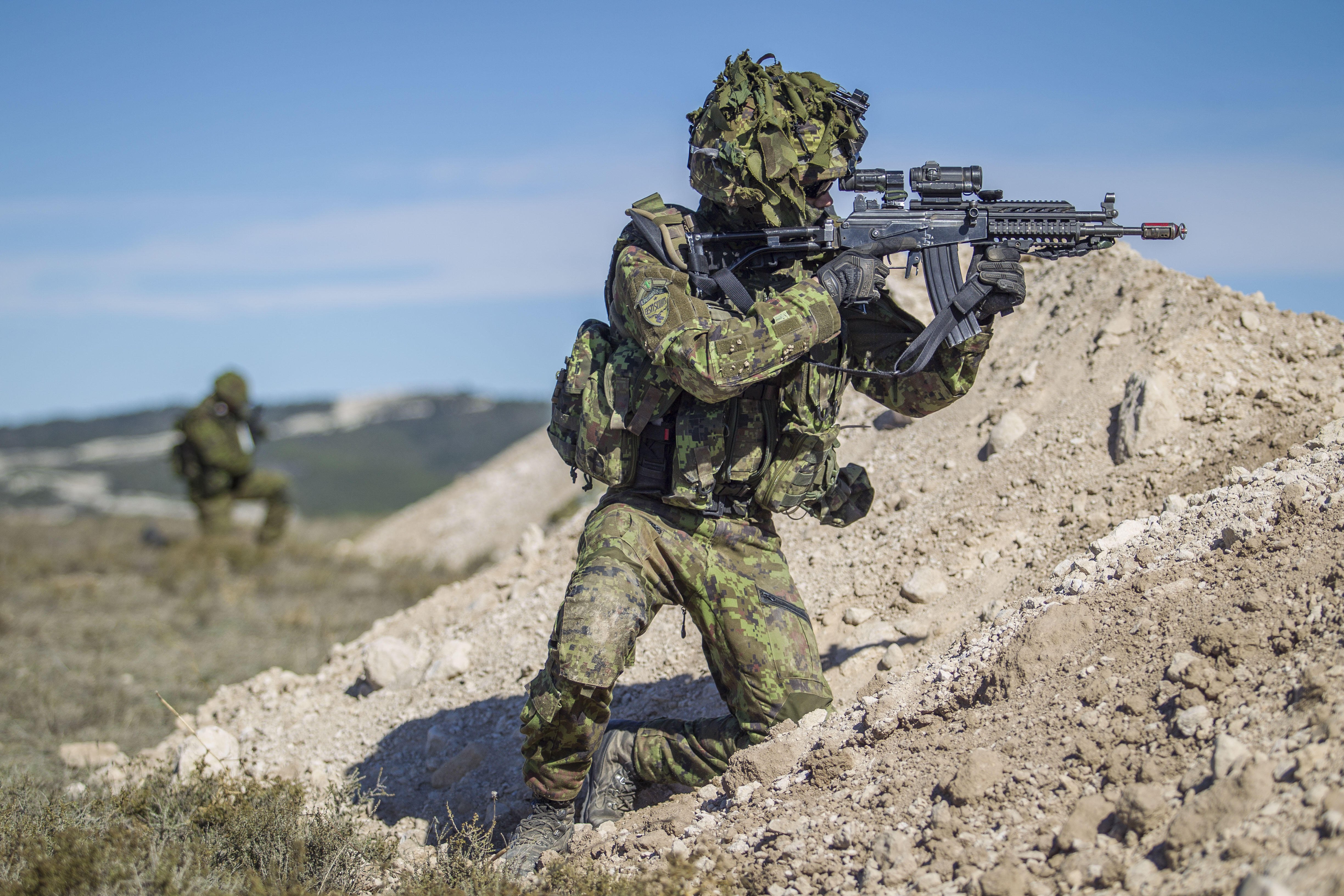Estonian soldiers participating in a NATO exercise in 2015. NATO membership is central to Estonia's defense policy, ensuring collective security and interoperability with allied forces.