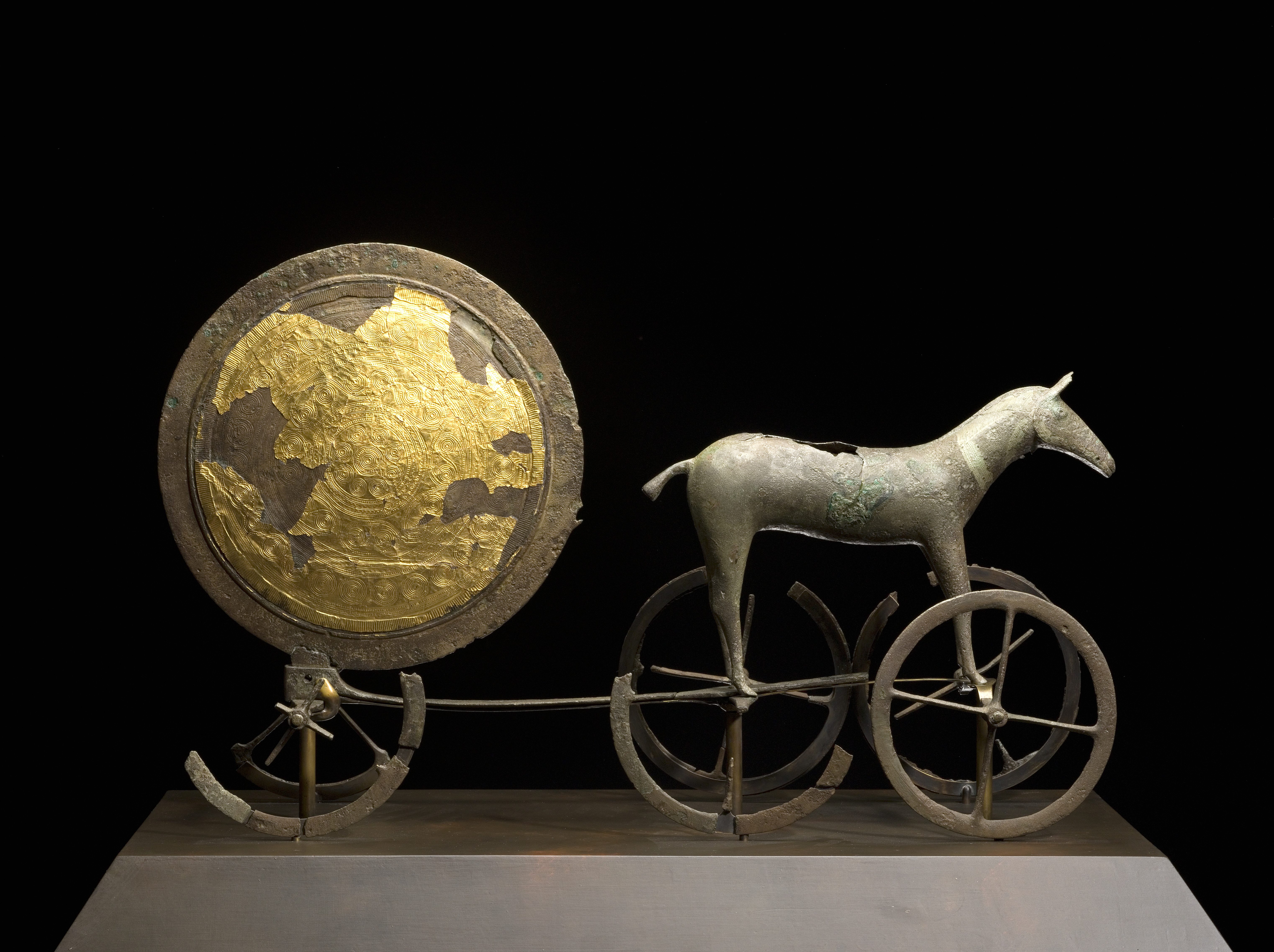 The gilded side of the Trundholm sun chariot, dating from the Nordic Bronze Age, a testament to early artistic and religious practices in Denmark.