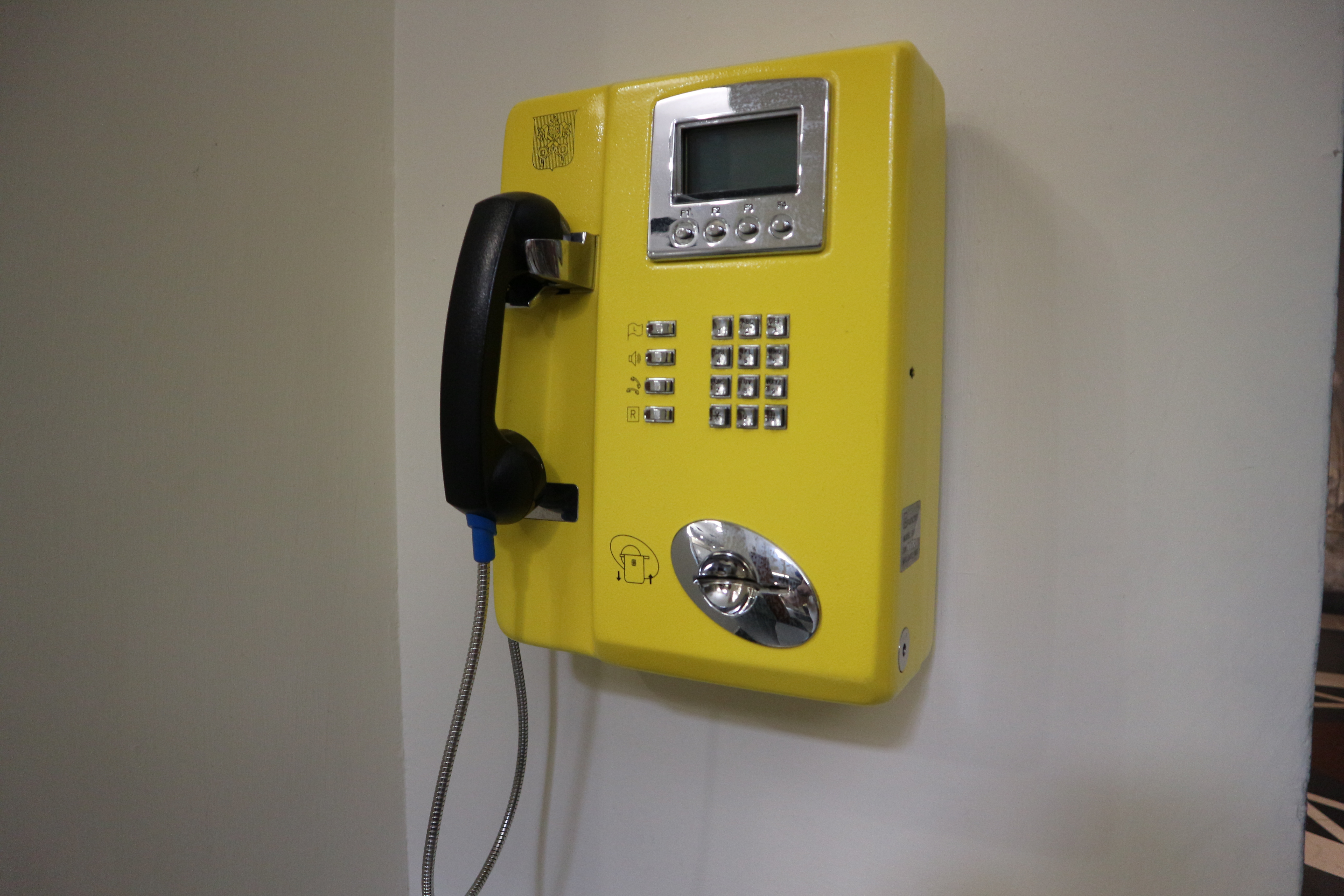 A public payphone in Vatican City, indicative of its independent telecommunications services.
