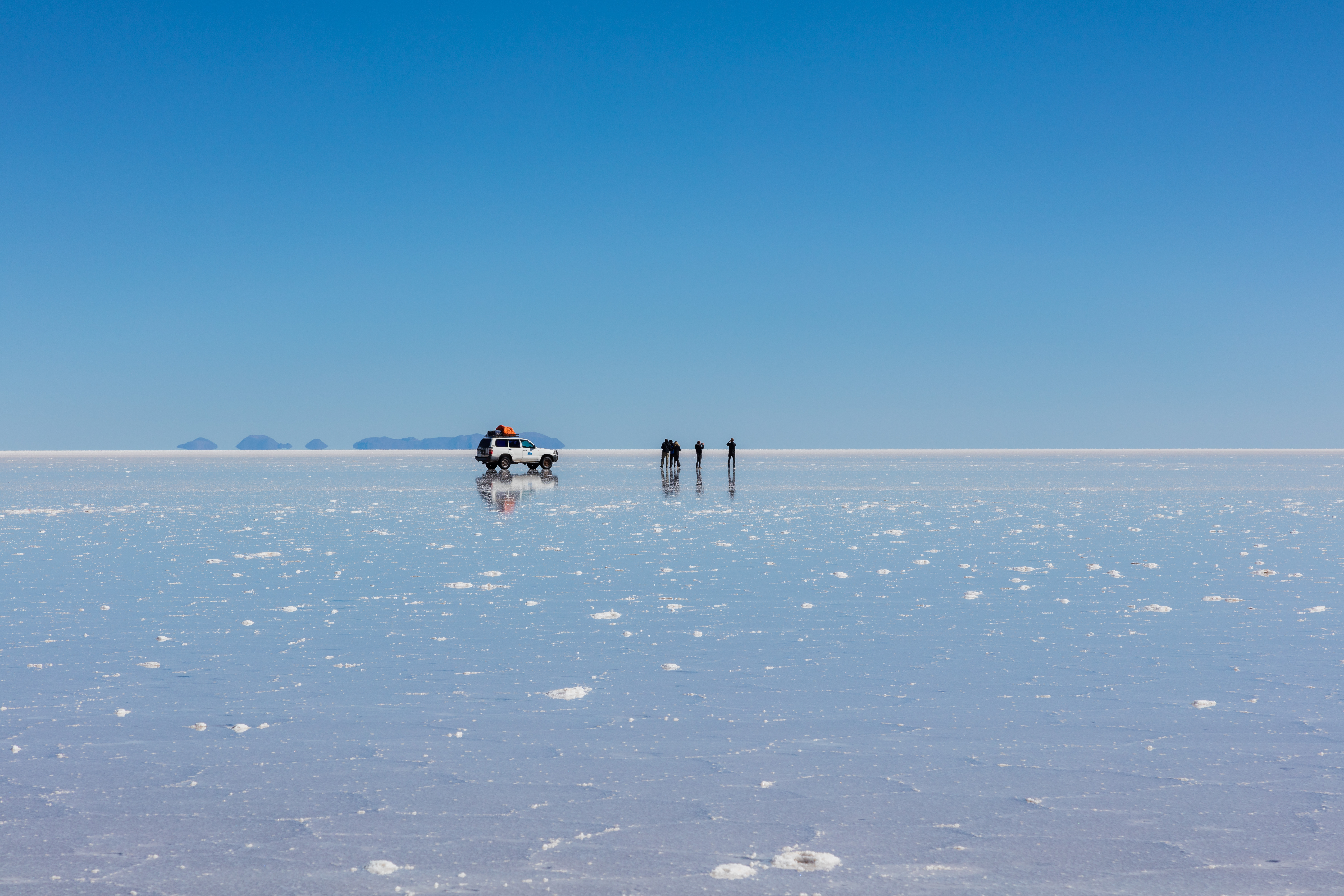 The Salar de Uyuni during the rainy season, creating a stunning mirror effect that attracts tourists worldwide.