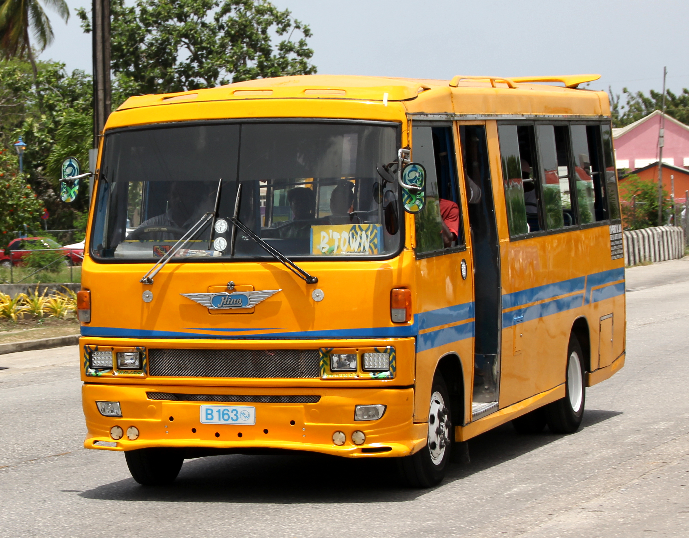 A Hino ACME Minibus B 163, a type of privately-owned public transport, in Speightstown, St. Peter, Barbados.