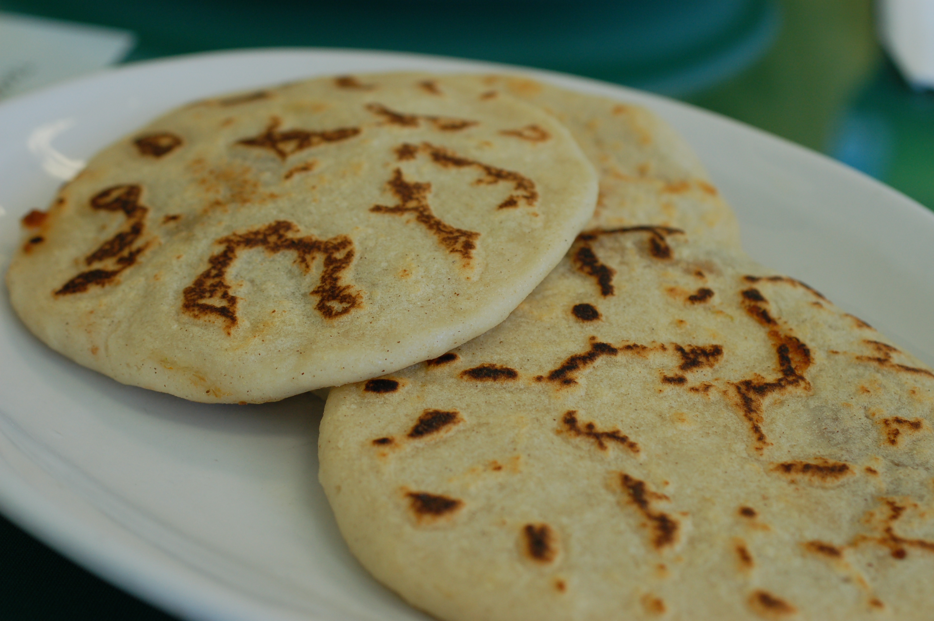 Pupusas, the national dish of El Salvador, are thick corn tortillas stuffed with various fillings.