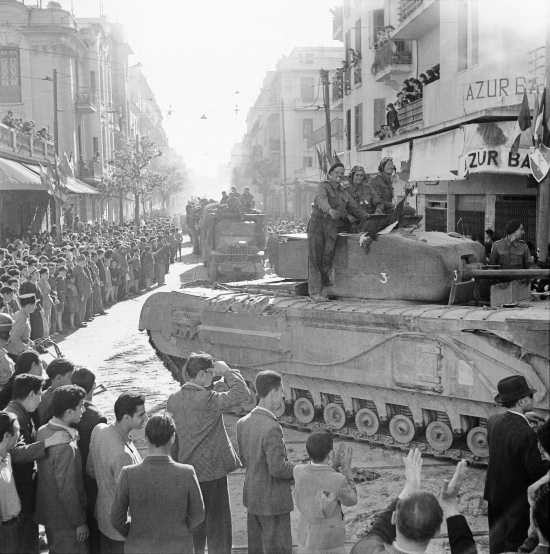 British tank moves through Tunis after the city was taken from Axis troops, May 8, 1943.