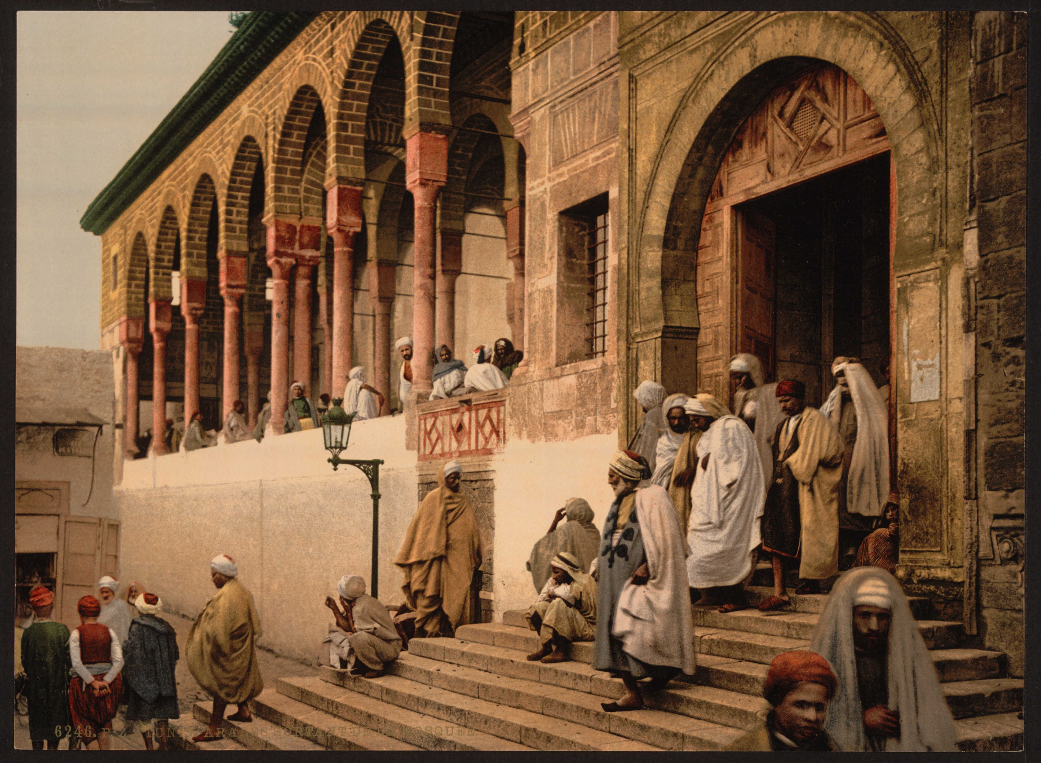 Arabs leaving a mosque in Tunis, c. 1899, reflecting the historical urban fabric.