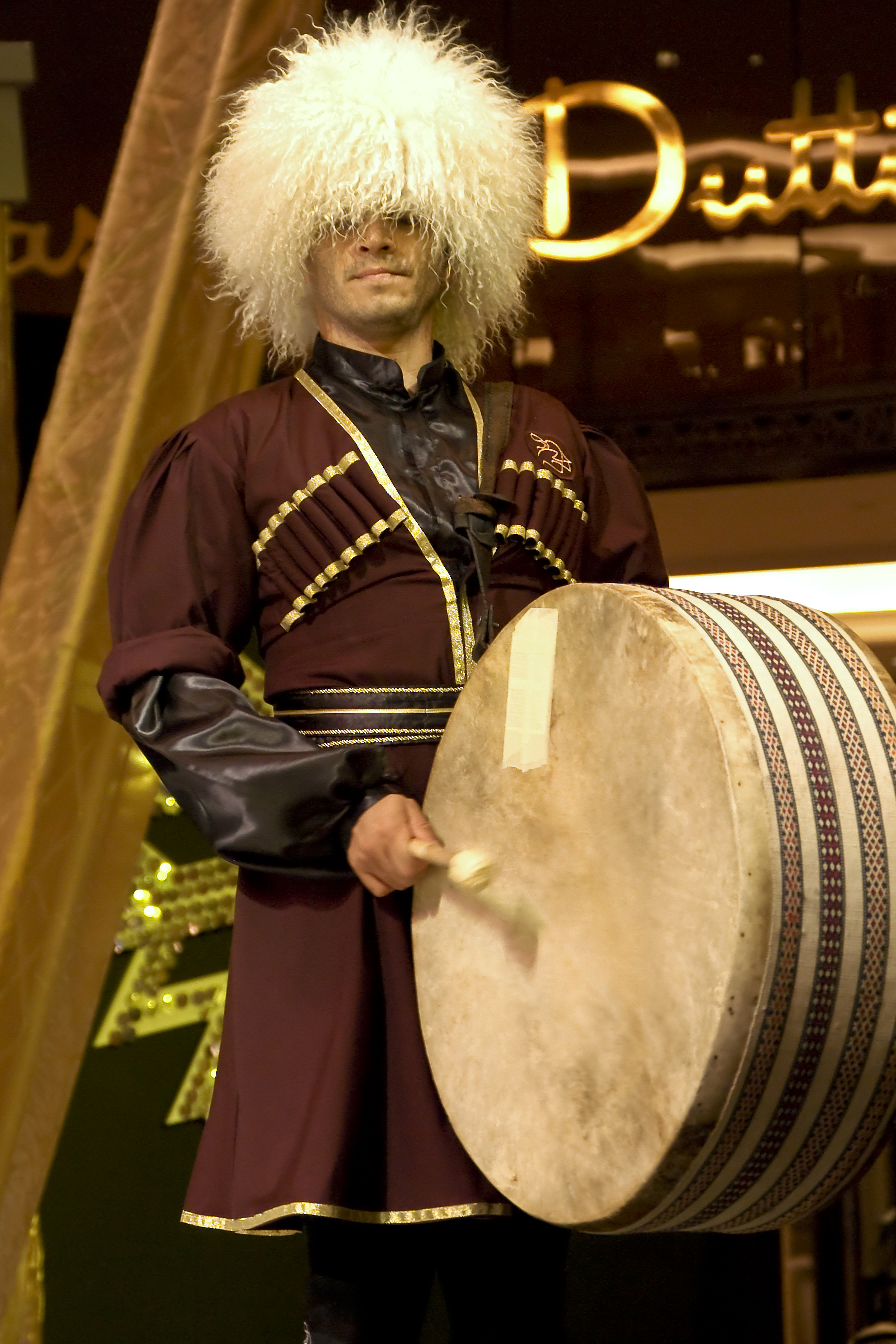 Traditional Azerbaijani clothing and musical instruments, showcasing cultural heritage.