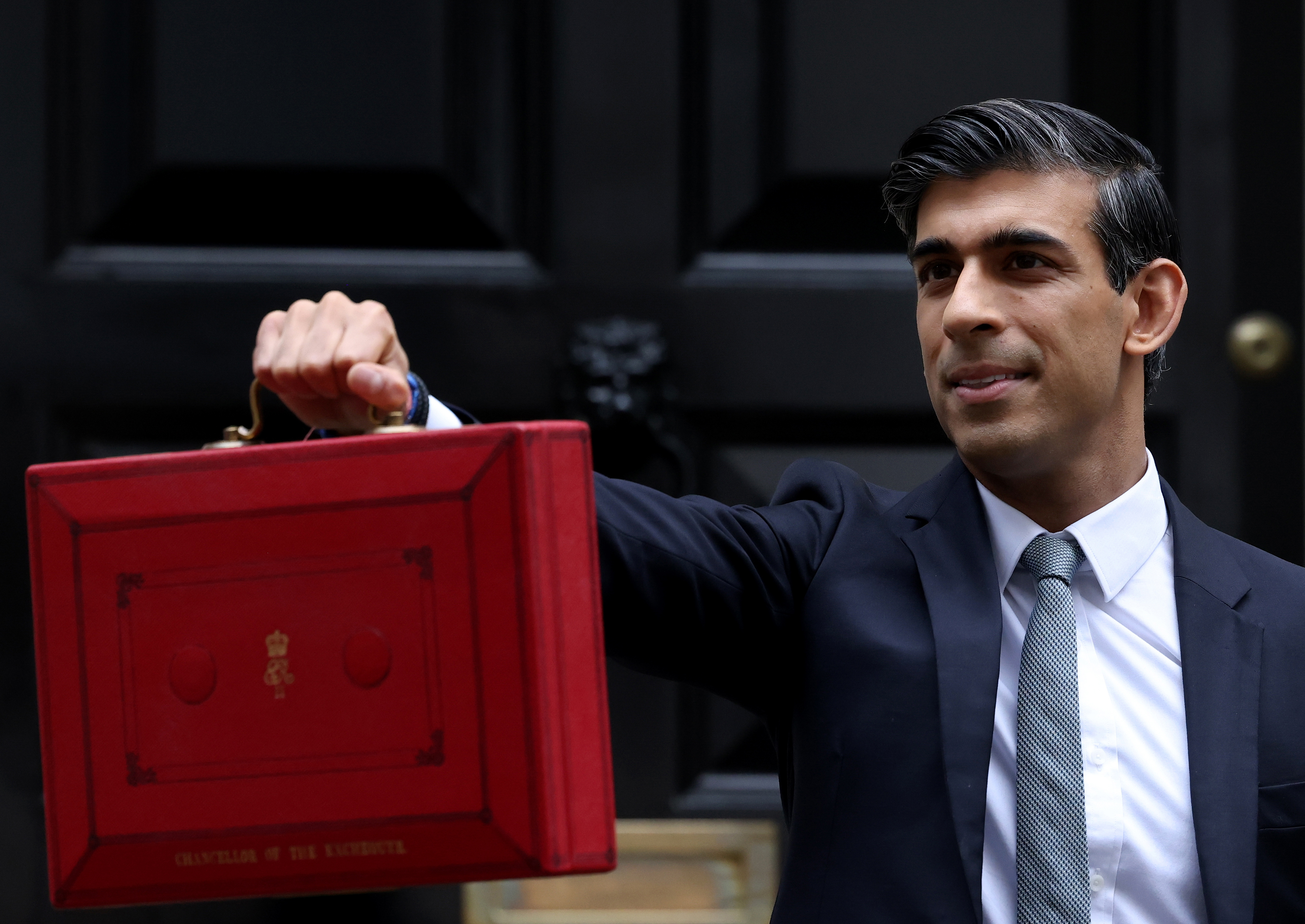 Sunak holding the budget box the day of the October 2021 budget