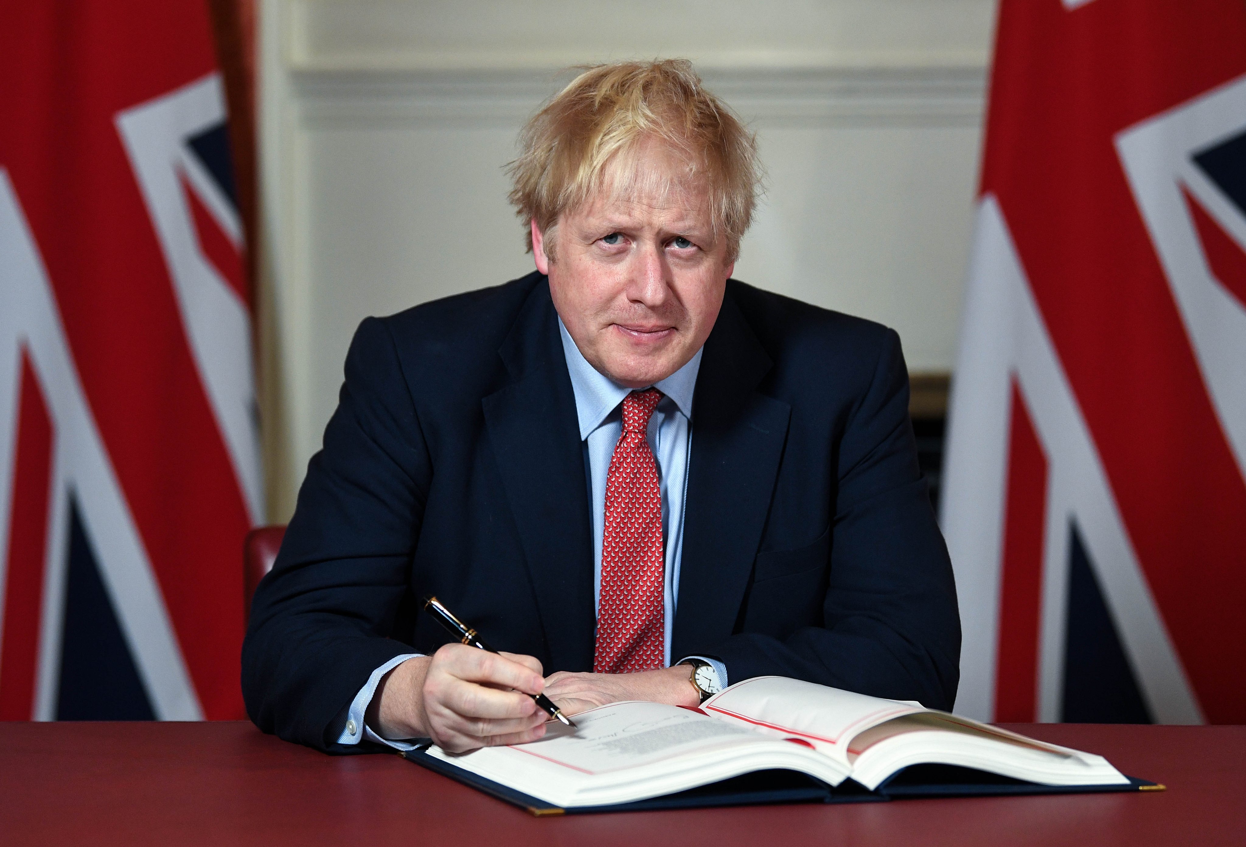 Prime Minister Boris Johnson signs the Brexit withdrawal agreement, formally withdrawing the UK from the European Union (EU).