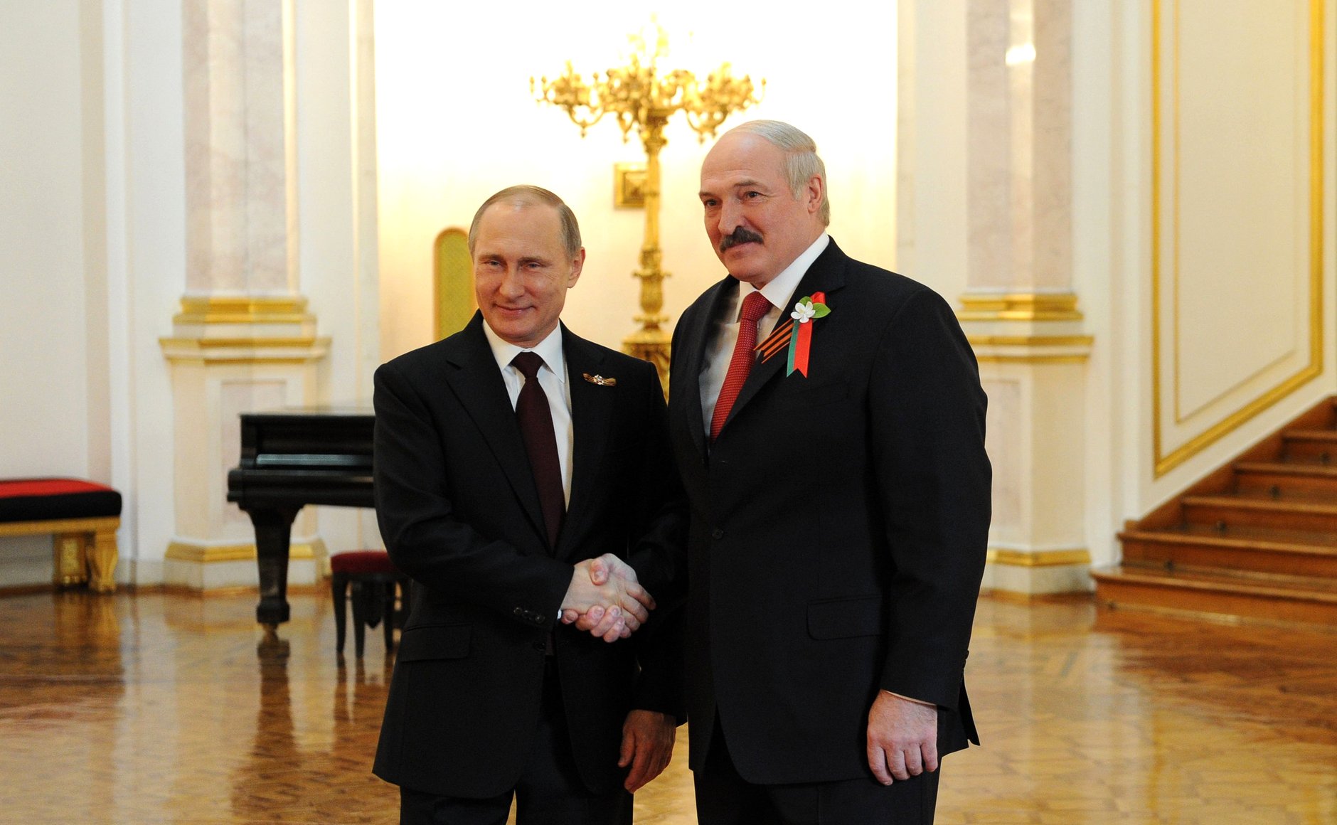 President Alexander Lukashenko shaking hands with Russian President Vladimir Putin, 2015.