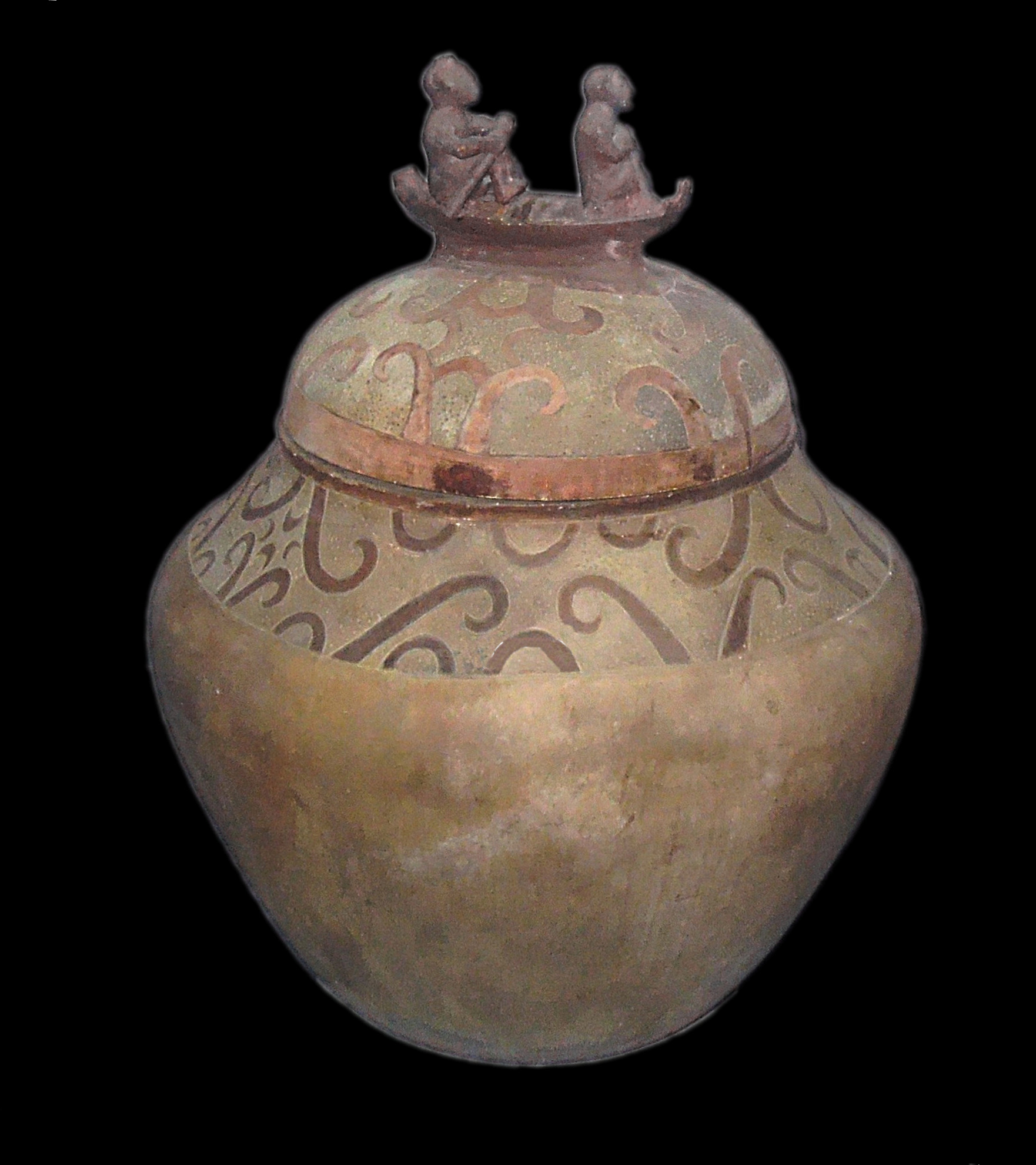 alt=A burial jar with its lid decorated with two people on a boat
