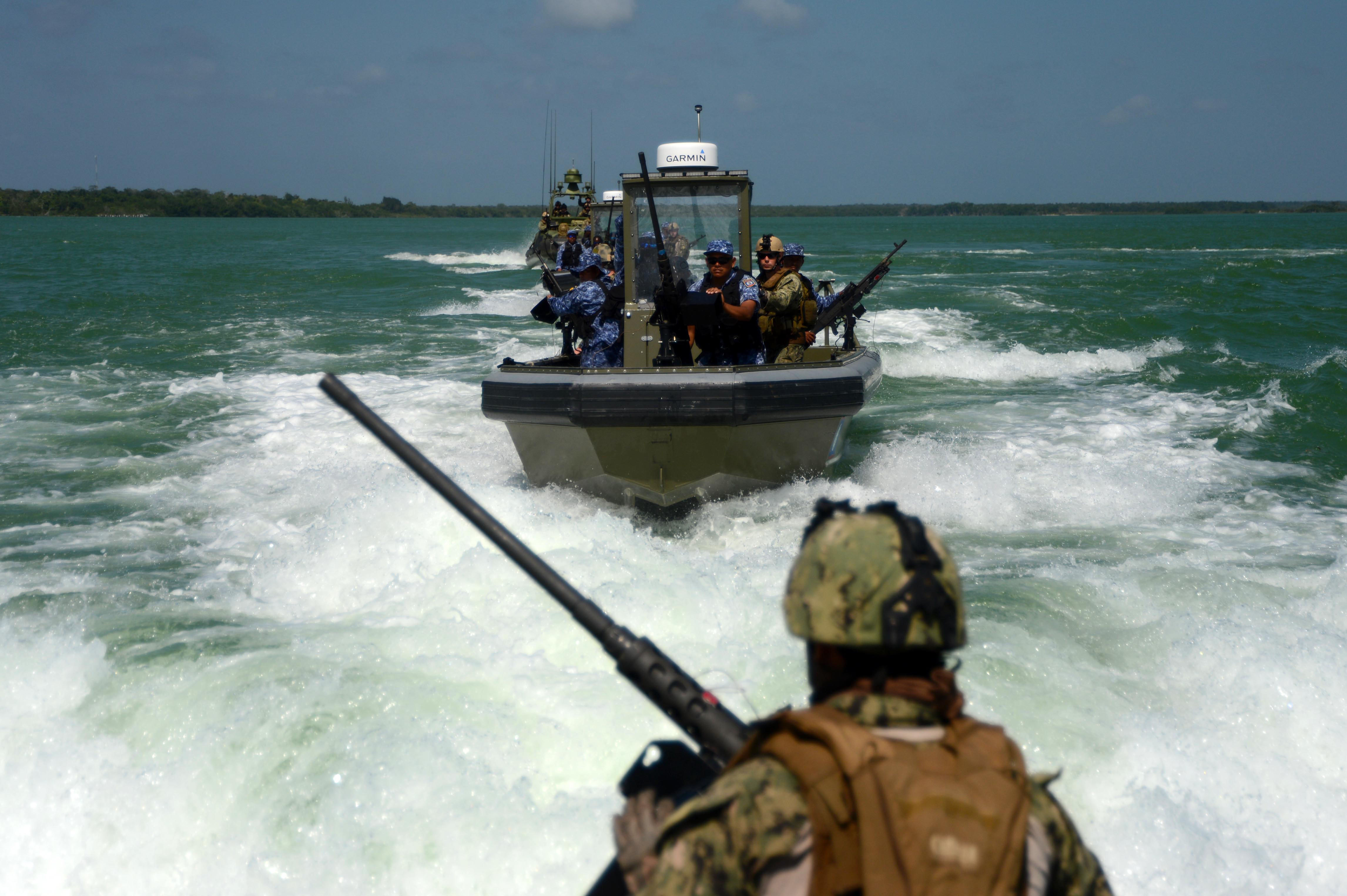 The Belize Coast Guard working with the United States Navy in a joint exercise.