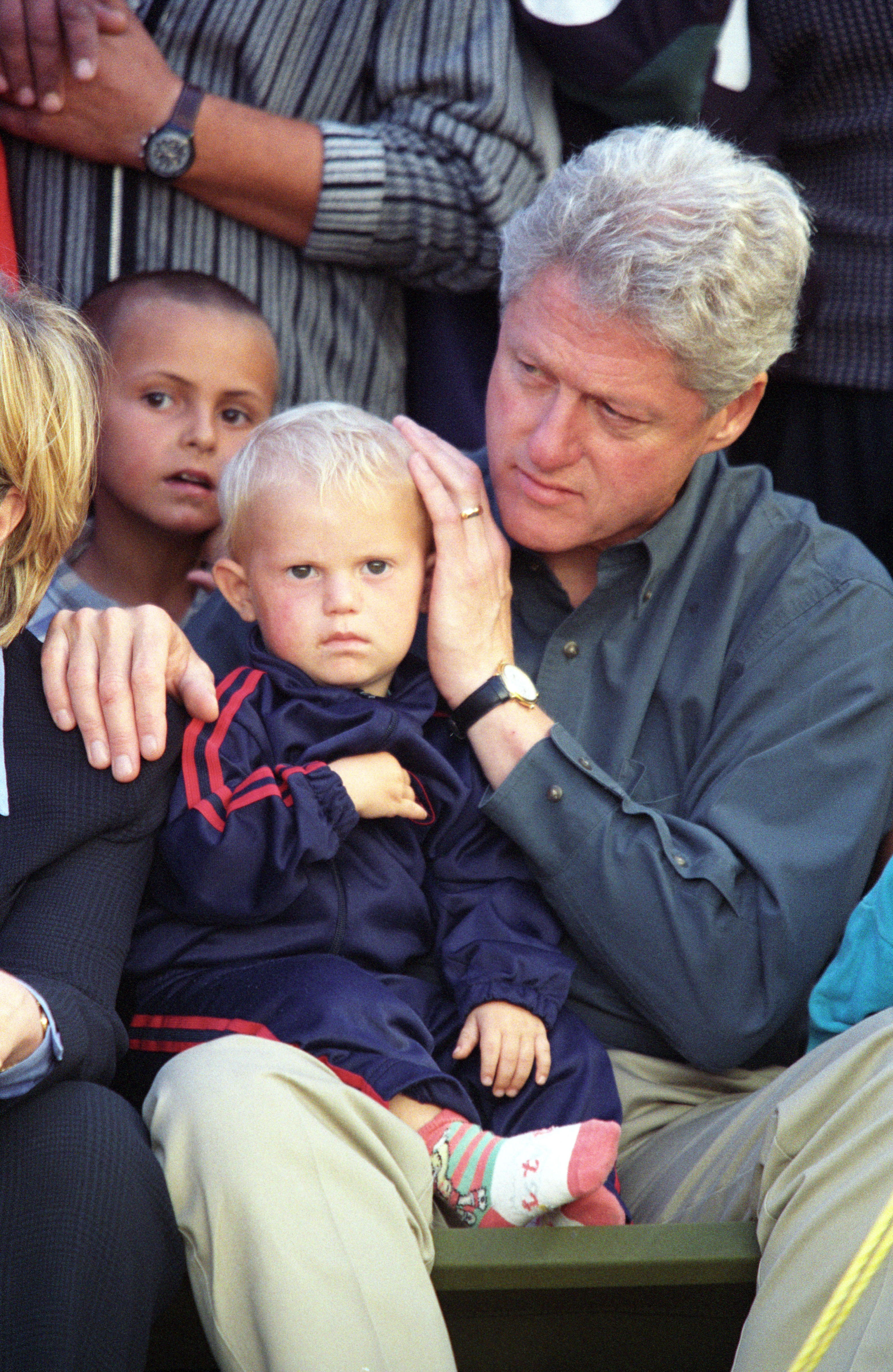 Then-U.S. President Bill Clinton with Kosovar Albanian refugee children during his visit to the Stenkovac I refugee camp in North Macedonia, June 1999, following the Kosovo War.