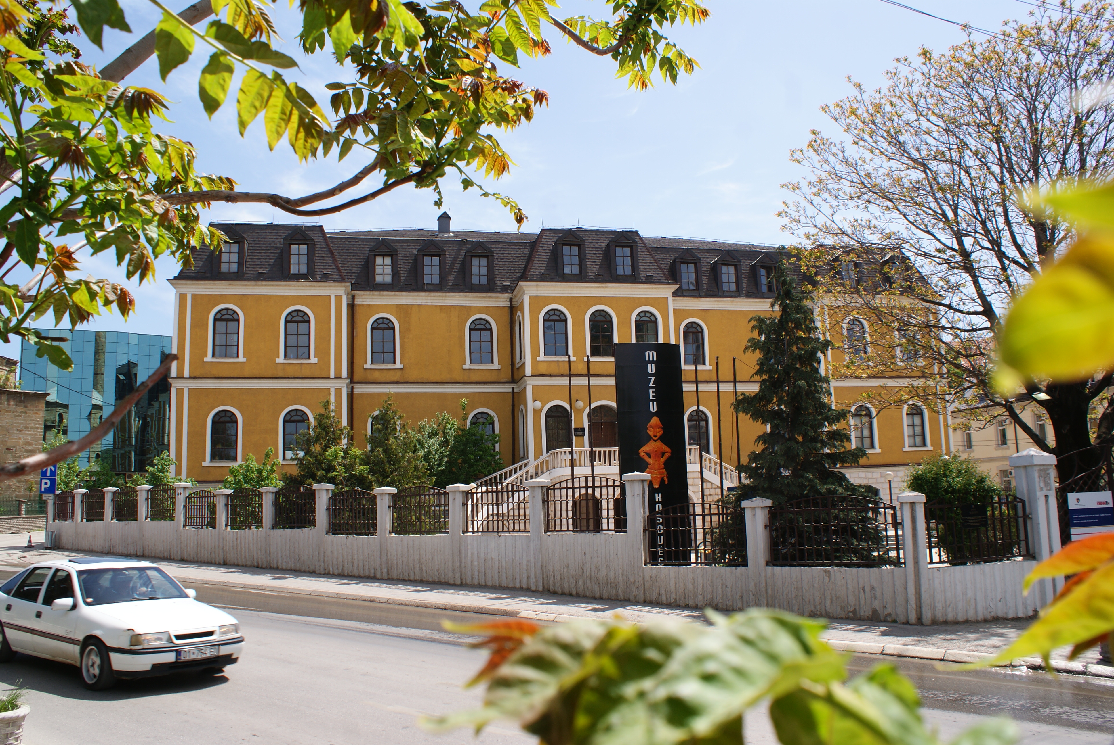 The Kosovo Museum in Pristina, housed in an Austro-Hungarian style building, showcases archaeological and ethnographic artifacts.