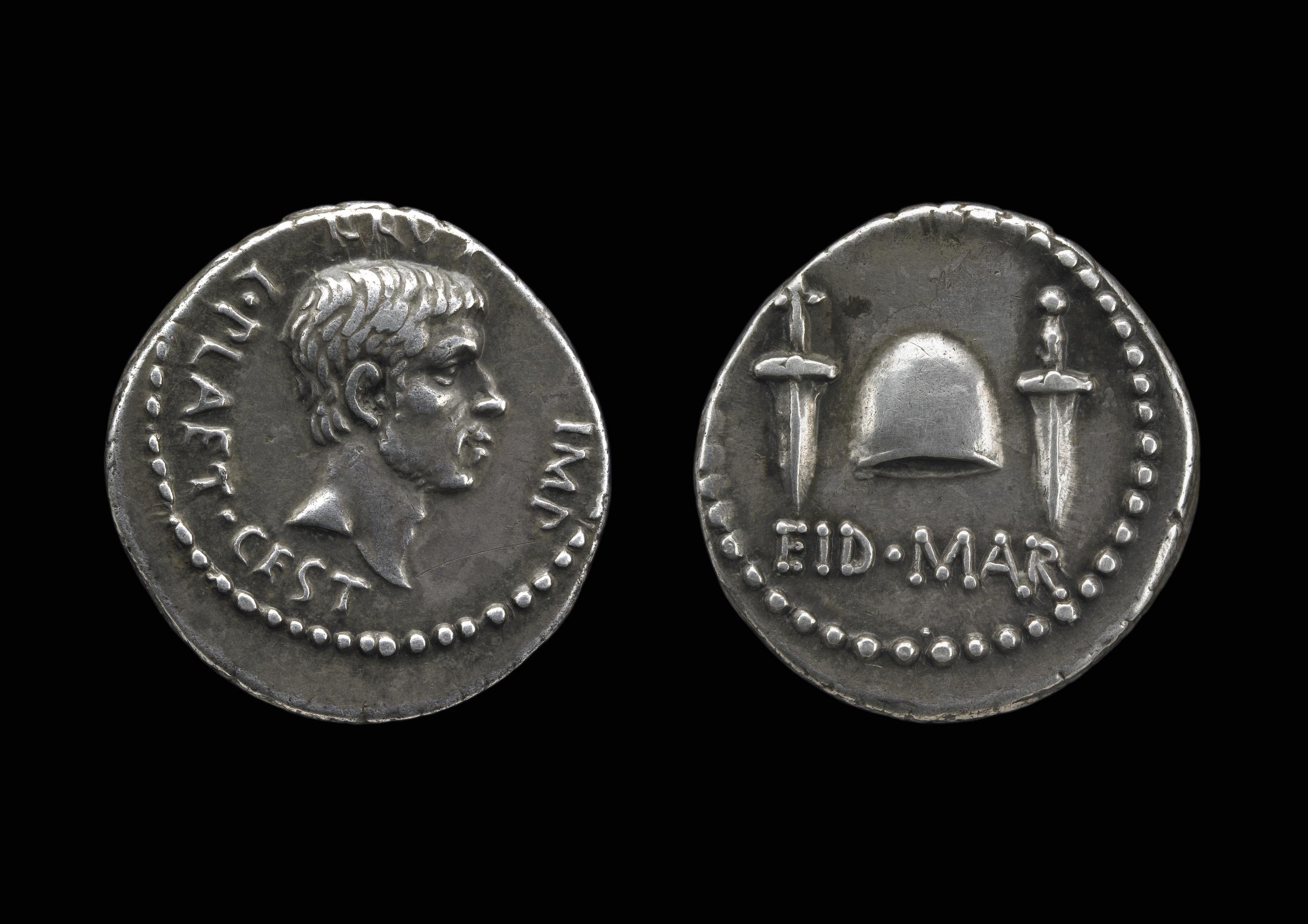 Ides of March coin yang dicetak oleh Brutus pada 43-42 SM. Keris dan pileus meraikan pembunuhan Julius Caesar.