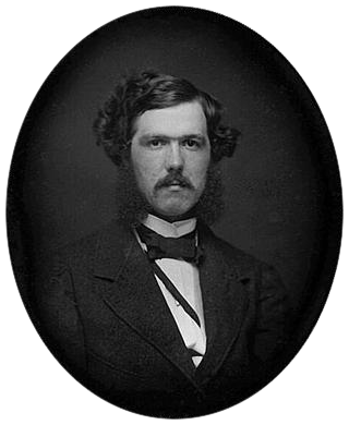 Black-and-white photograph of a young man with a mustache