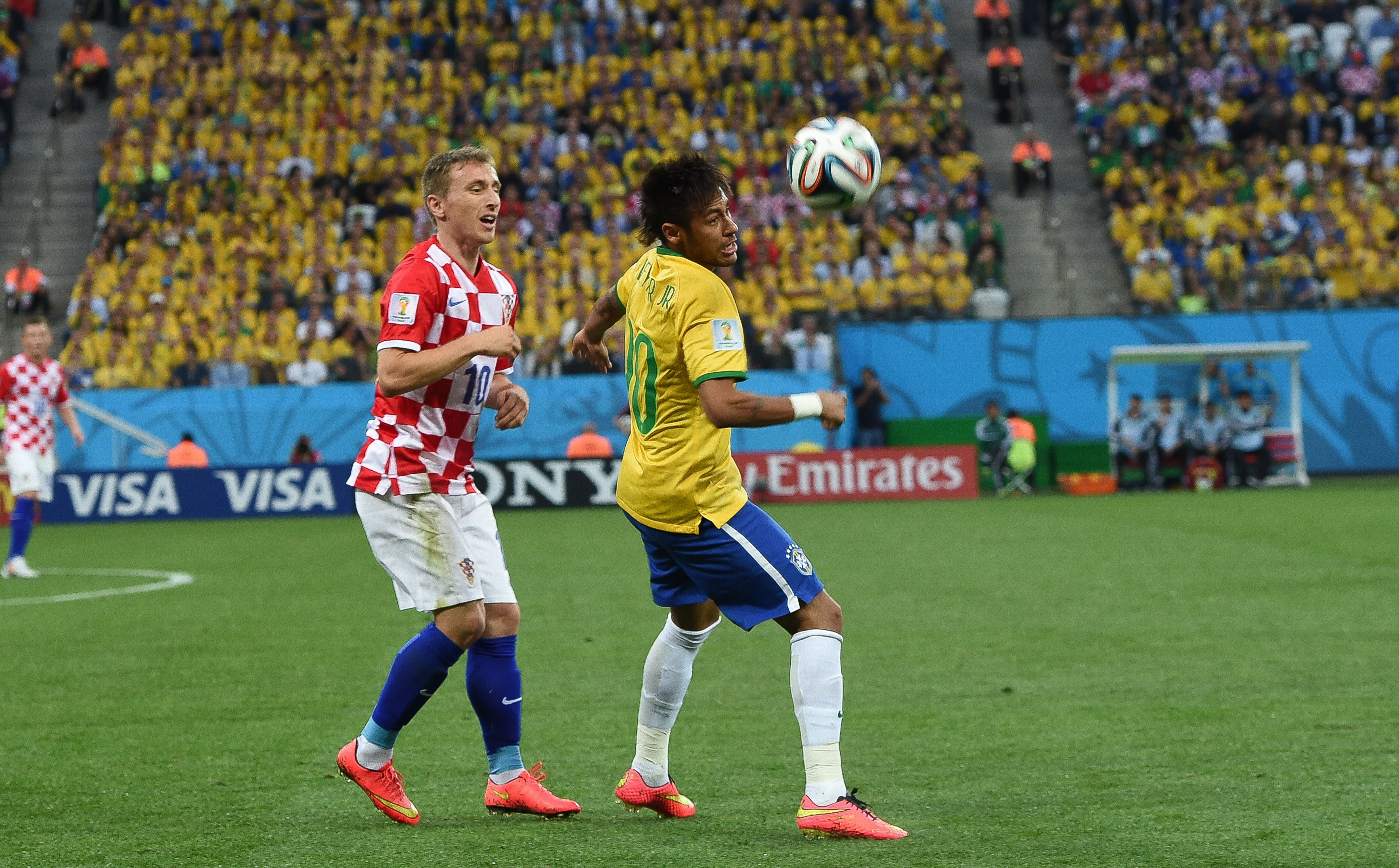 Modrić playing against Neymar of Brazil at the 2014 FIFA World Cup.