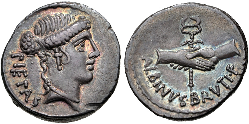 Đồng denarius của Decimus Brutus, được đúc vào năm 48 TCN. Mặt trước miêu tả Pietas, trong khi mặt sau thể hiện đôi tay nắm chặt quanh một caduceus, ám chỉ chính sách hòa giải của Julius Caesar trong Nội chiến Caesar (Decimus vẫn ủng hộ Caesar vào thời điểm này).