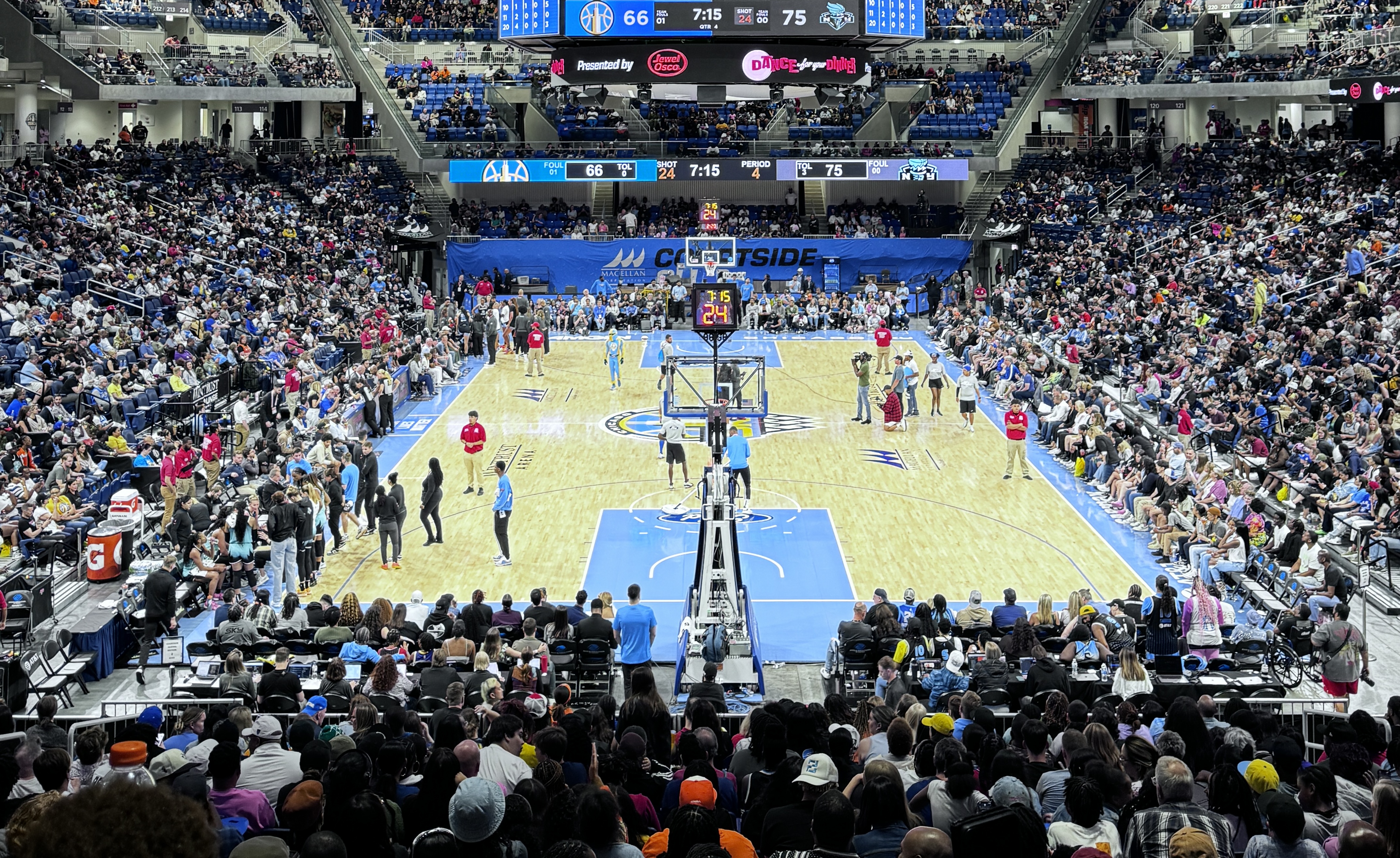 packed basketball stadium with Sky blue Paint