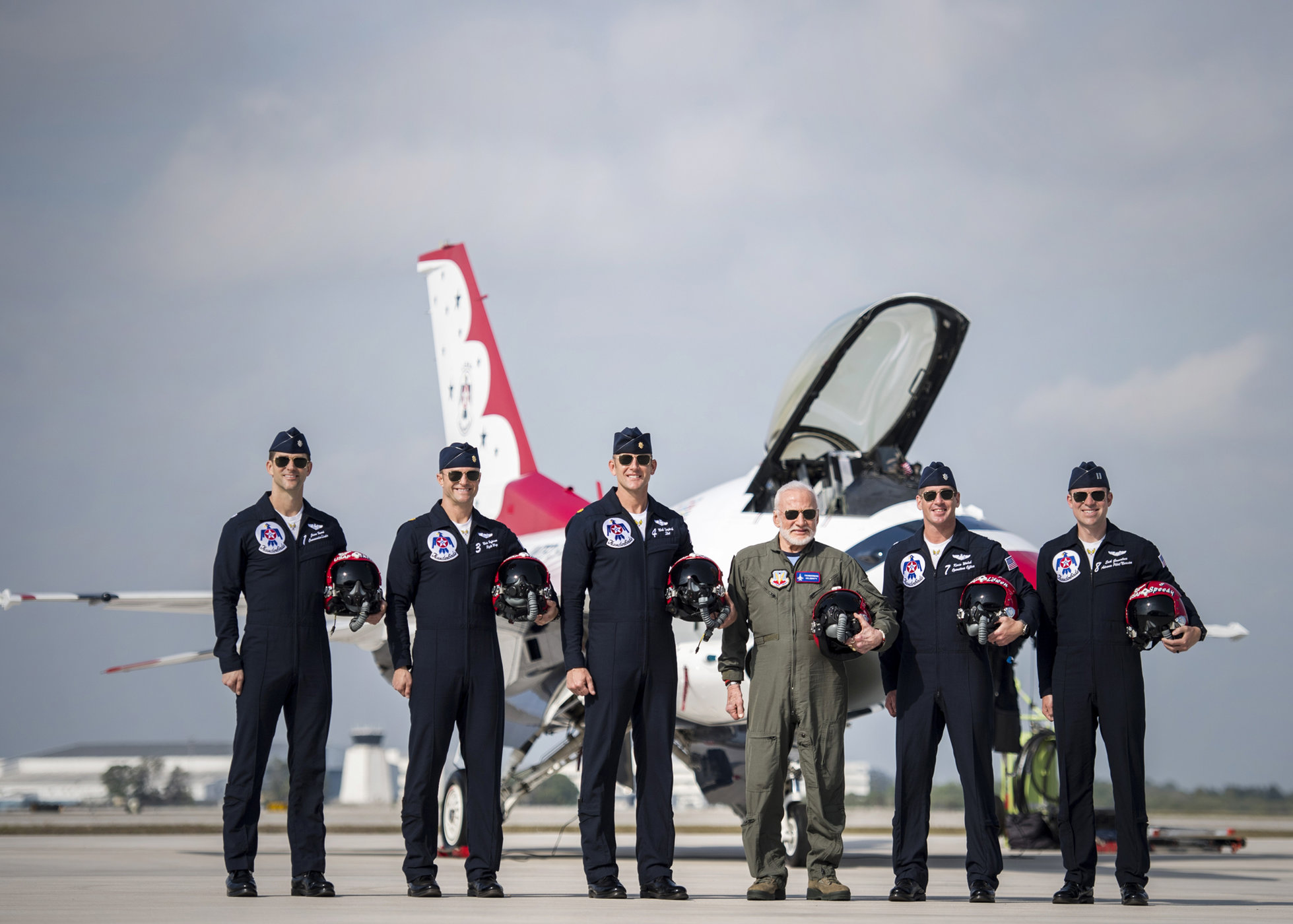 USAF Thunderbirds pilots pose for a photo with Aldrin prior to his flight at an air show in Melbourne, Florida, on April 2, 2017. Aldrin became the oldest person to fly with the Thunderbirds.