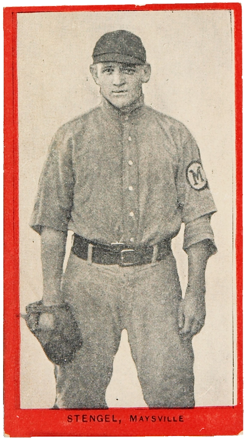 a young man in an old-style baseball uniform wears a glove and stares at the camera