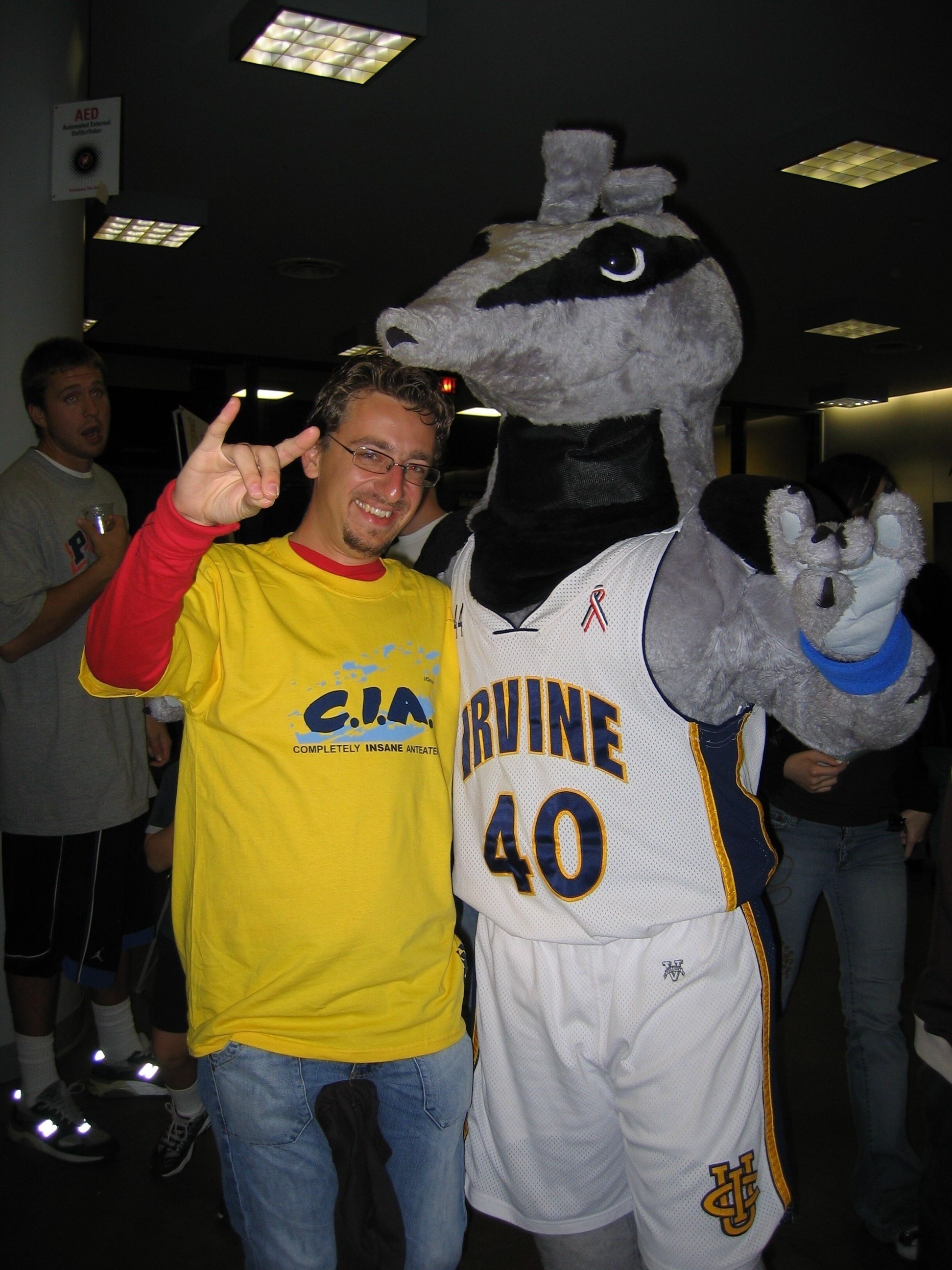 A person in a mascot costume dressed as Peter the Anteater performs the