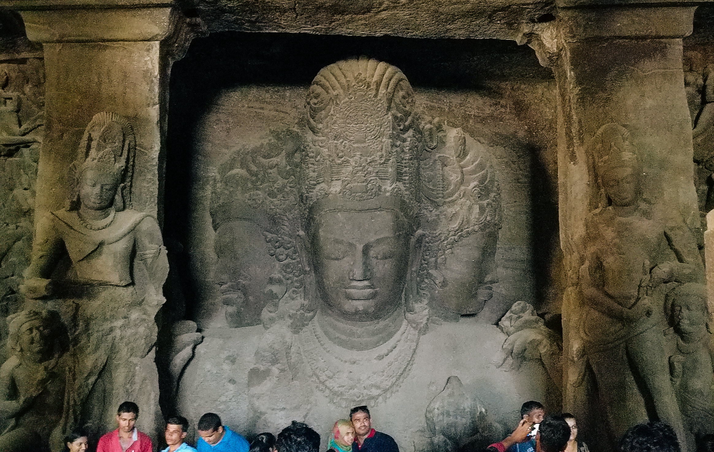 Elephanta Caves, triple-bust (trimurti) of Shiva, 18 ft tall, circa 550 CE. This monumental rock-cut sculpture exemplifies the grandeur of classical Indian art.
