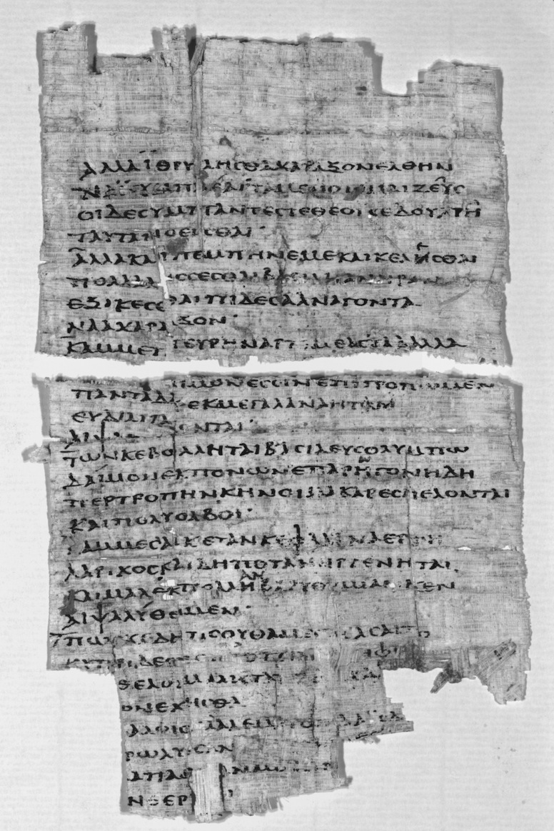 Black and white photograph of a fragment of papyrus with Greek text